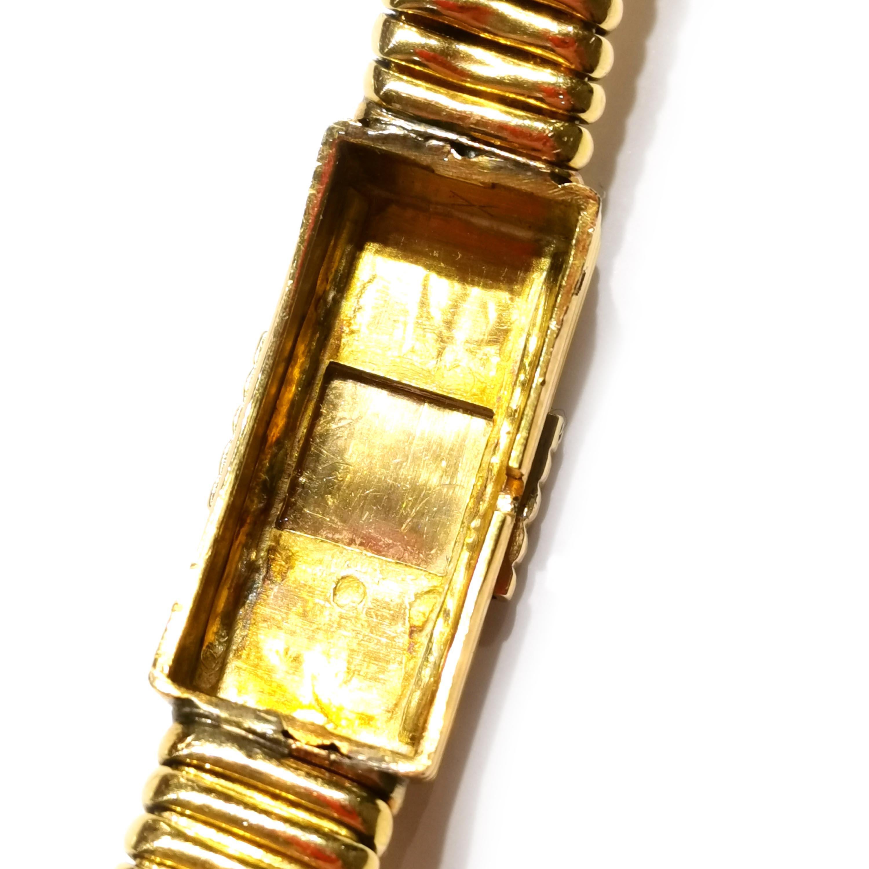 Reloj vintage Universal de oro con tapa deslizante, circa 1950 5