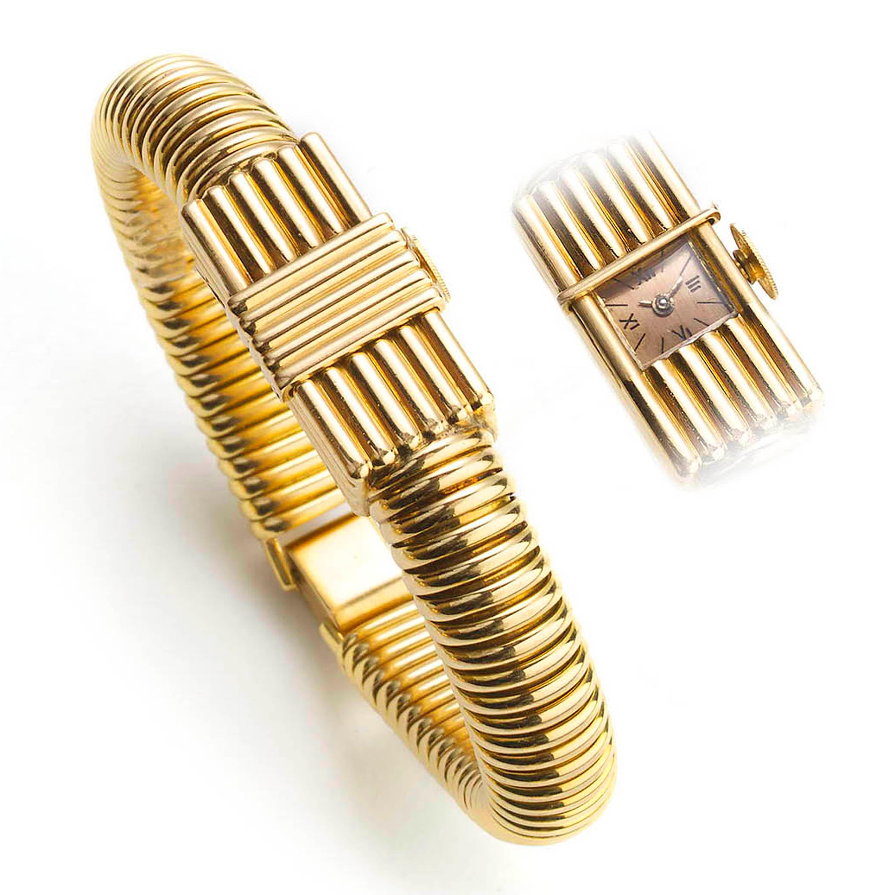 Reloj de pulsera de época, Universal, para señora, con tapa corredera acanalada sobre la esfera rectangular, con esfera satinada de color cobre, con números romanos estilizados negros en los cuartos, con indicadores de bastón, para los números