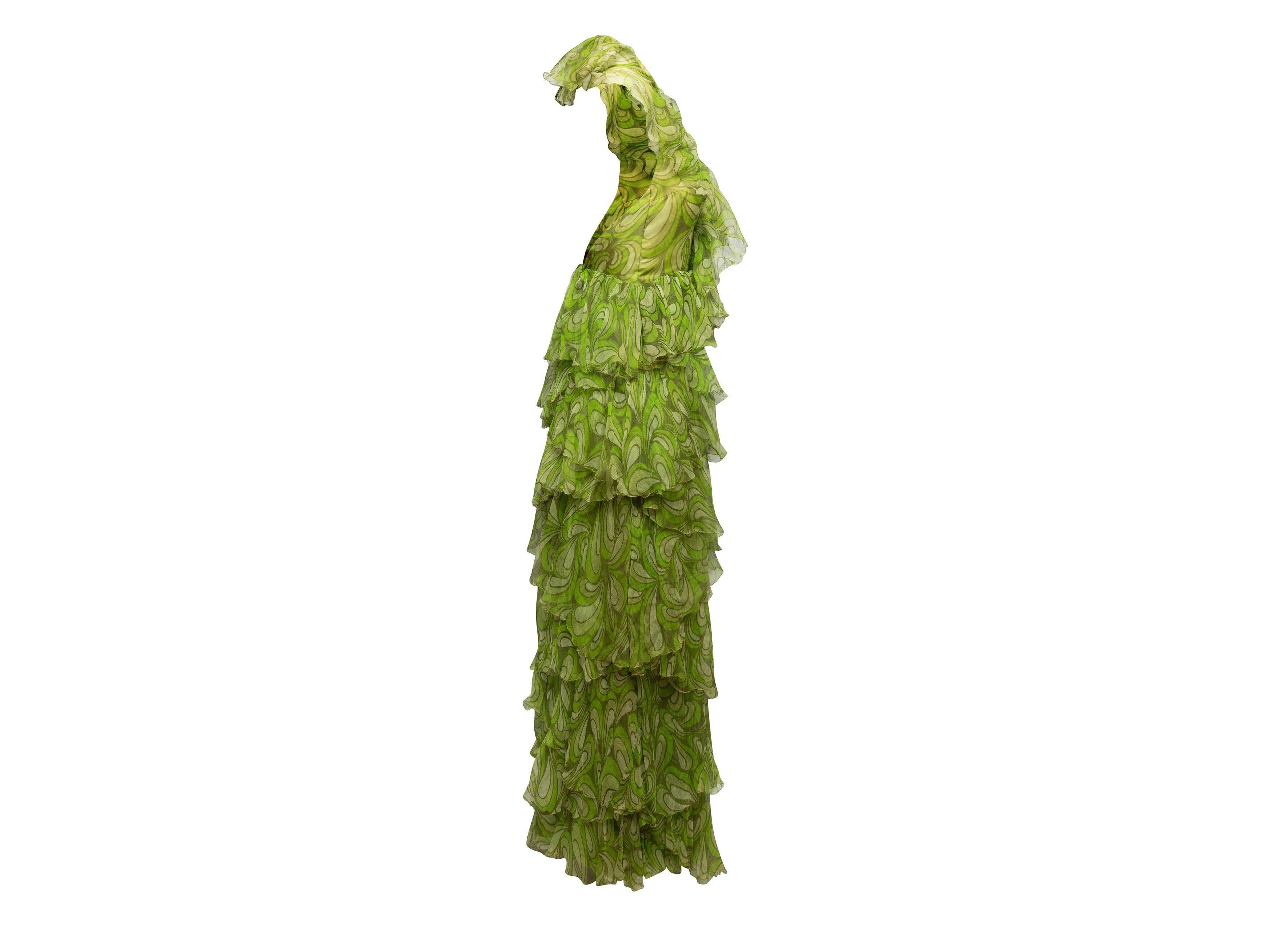 Product Details: Vintage green abstract print silk ruffle halter jumpsuit. V-neck. Zip closure at center back. 28