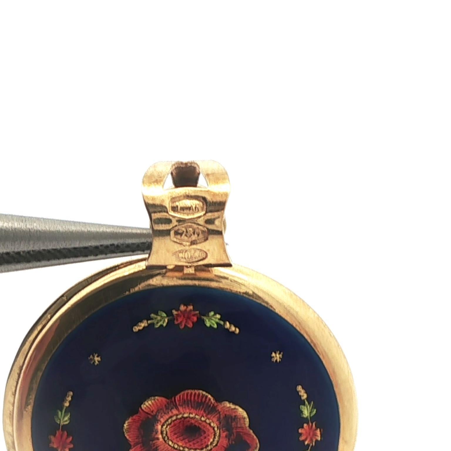 Donna Ciondolo girevole d'epoca UnoAErre in oro blu e smalto colorato in vendita