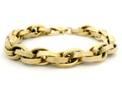 Pulsera de eslabones entrelazados vintage UNOARRE de oro de 14k con motivos florales texturizados