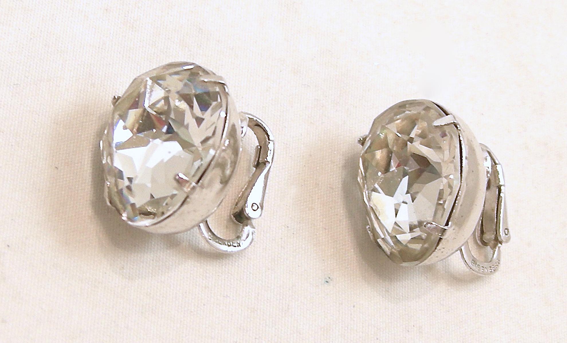  Although these beautiful crystal pear shaped earrings are unsigned … it is made with the same Eisenberg style and design. It is made in a silver tone setting.  In excellent condition, these clip earrings measure 3/4” x 1/2”.