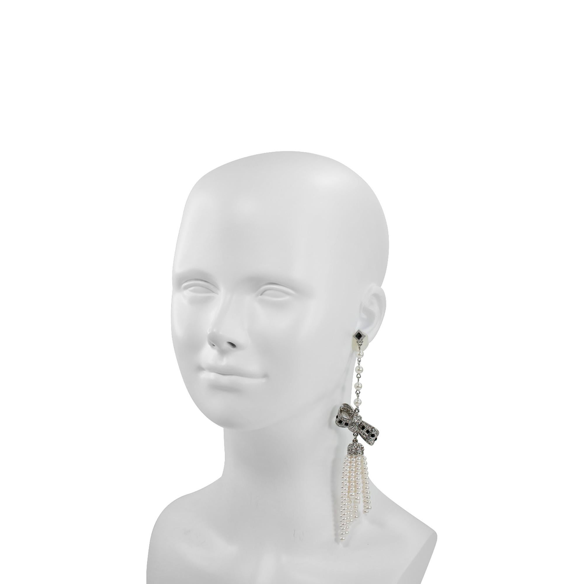 Modern Vintage Unsigned Long Dangling Pearl and Rhinestone Bow Earring, Circa 1990s For Sale