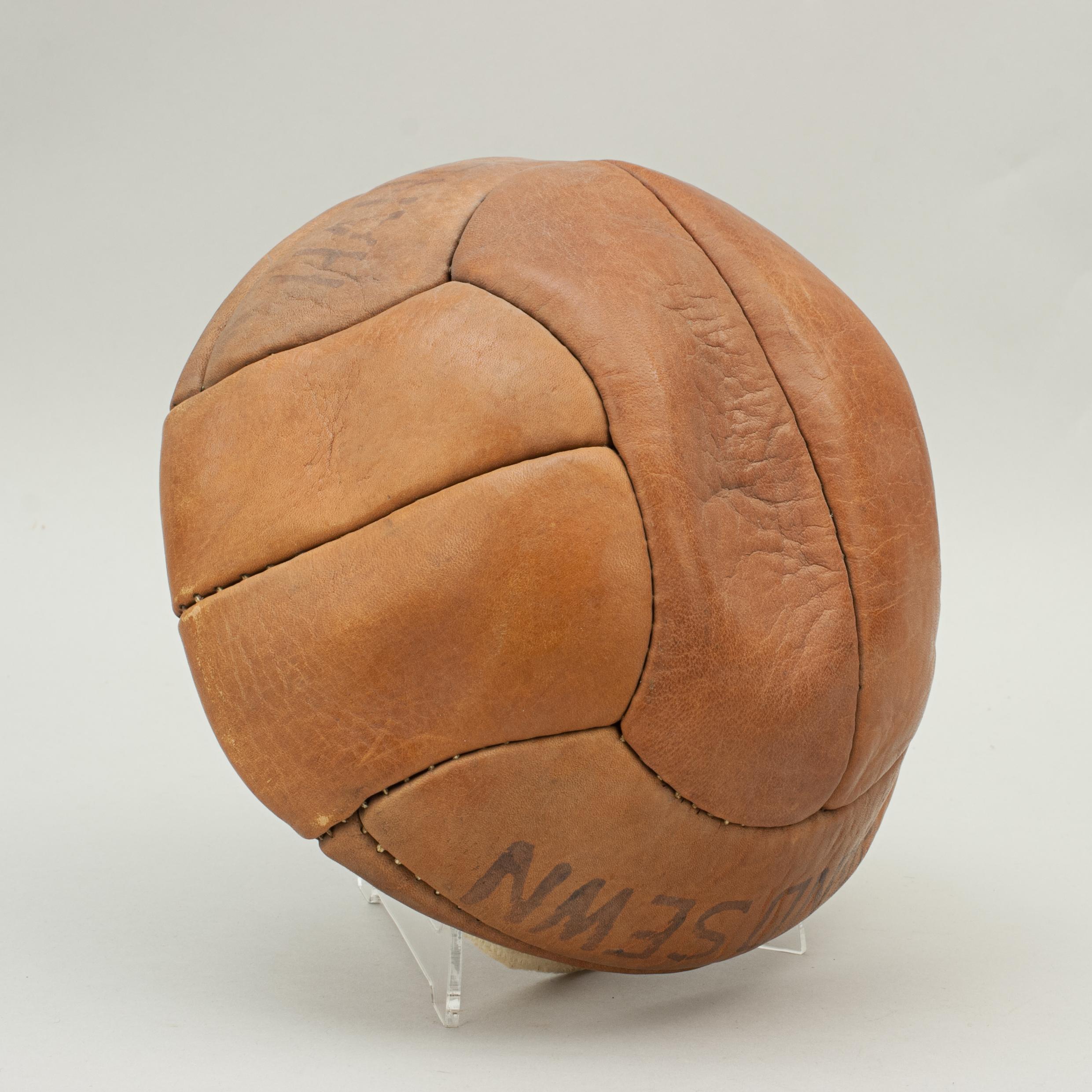 Vintage unused leather football.
A traditional hand sewn 12-panel tan leather football in original condition. The unused ball has a lace-up slit to the top to enable bladder inflation and is called 'SERVICE'. It is a No. 4 ball made of genuine