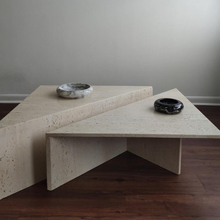 Vintage Up & Up unfilled travertine coffee table with a honed finish. Tiered triangular design and timeless style. This modular set can be styled in many different ways. C. 1970s. Unfilled travertine is a porous material and has natural