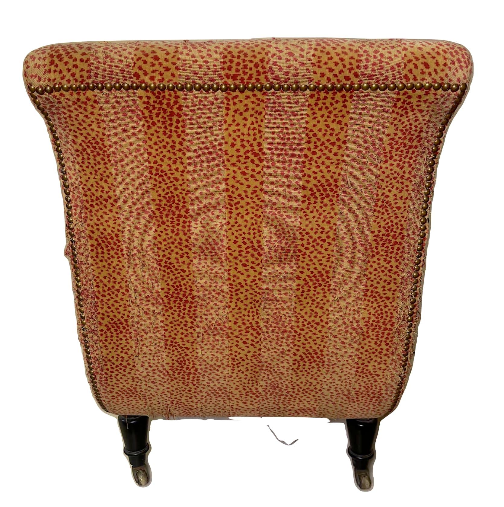 Upholstered club chair with front and back leg casters. Timeless and striking, the chair can be in an interior setting or capture the eye in any environment.
