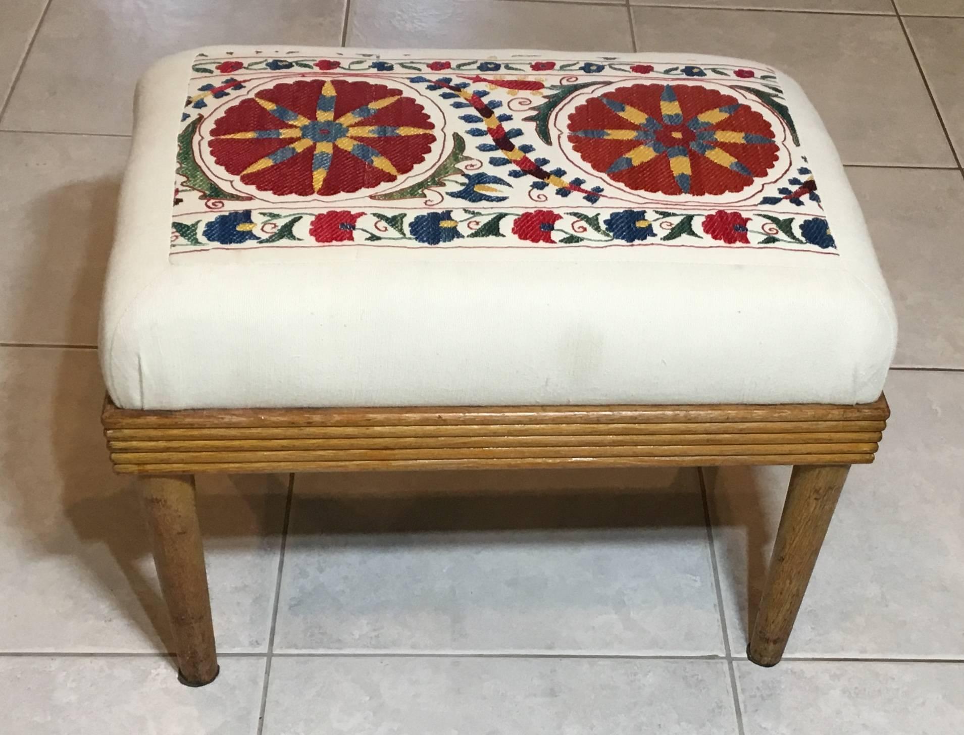 Elegant sitting stool made of wood, upholstered with beautiful hand embroidery silk Suzani textile, firm sitting, and great decorative vintage stool.
 