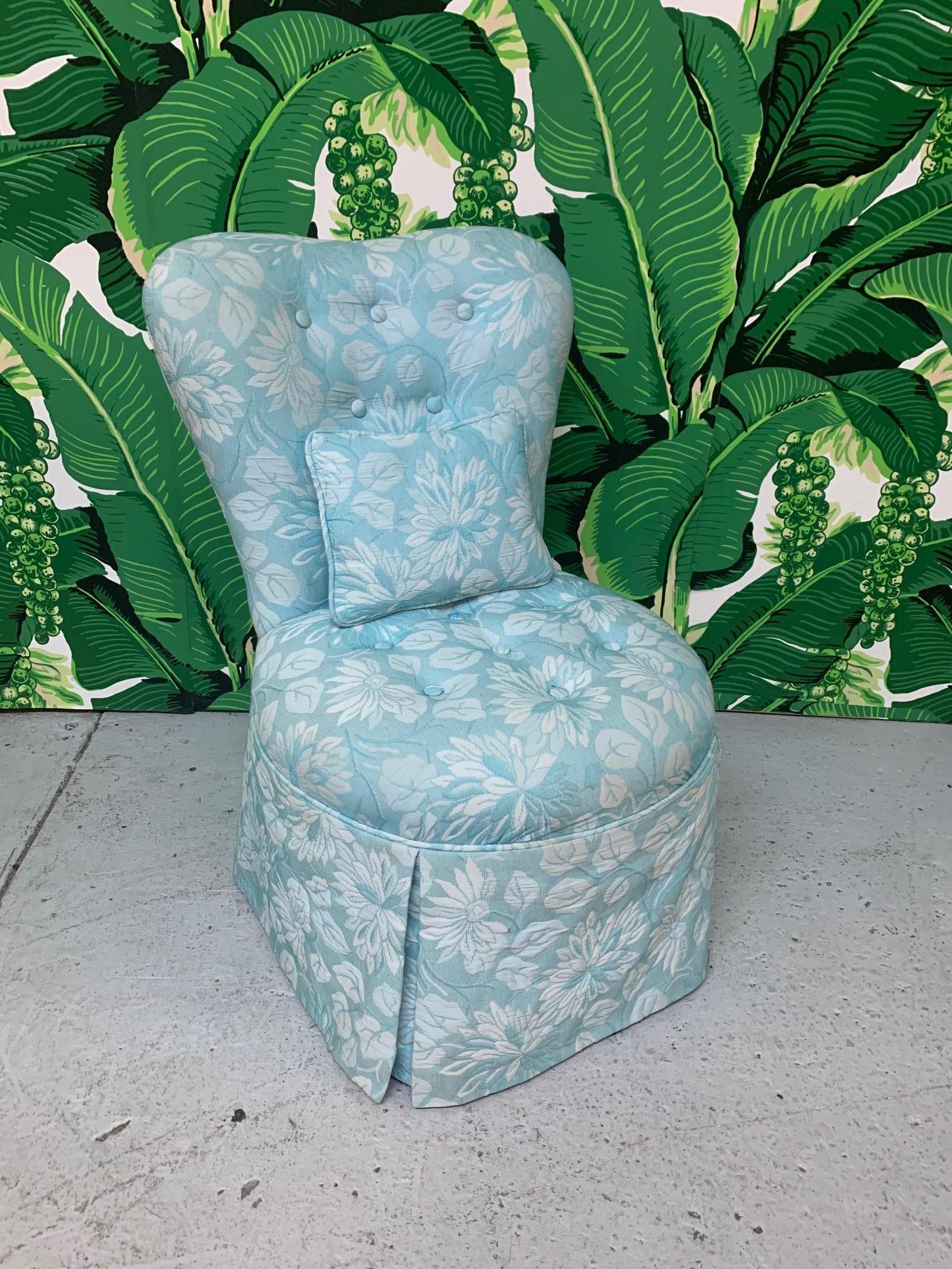 Single vanity chair features soft upholstery and very comfortable seat. Slipper chair style with sculptural back and tone-on-tone print. Excellent condition with no stains, tears or odors.