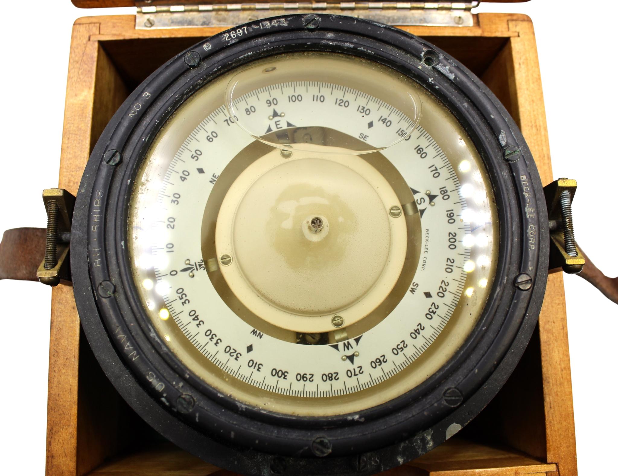 Presented is a U.S. Navy gimballed compass from 1943. The brass compass is beautifully constructed and fitted in a wooden lidded box with buckle. The compass is mounted on a 360-degree brass gimbal ring system. The gimbal ring design allows the