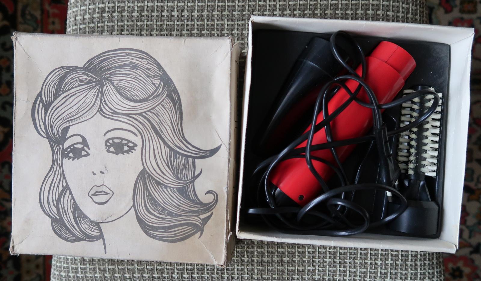 Step back in time to the glamour of the 1980s with this delightful vintage USSR electric hair dryer. Radiating a nostalgic charm, this hair dryer features a striking combination of red and black colors, a classic hallmark of its era. Proudly bearing