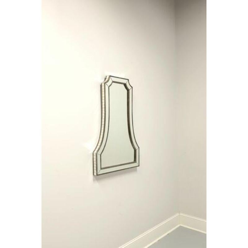 A Contemporary style wall mirror by Uttermost, their 