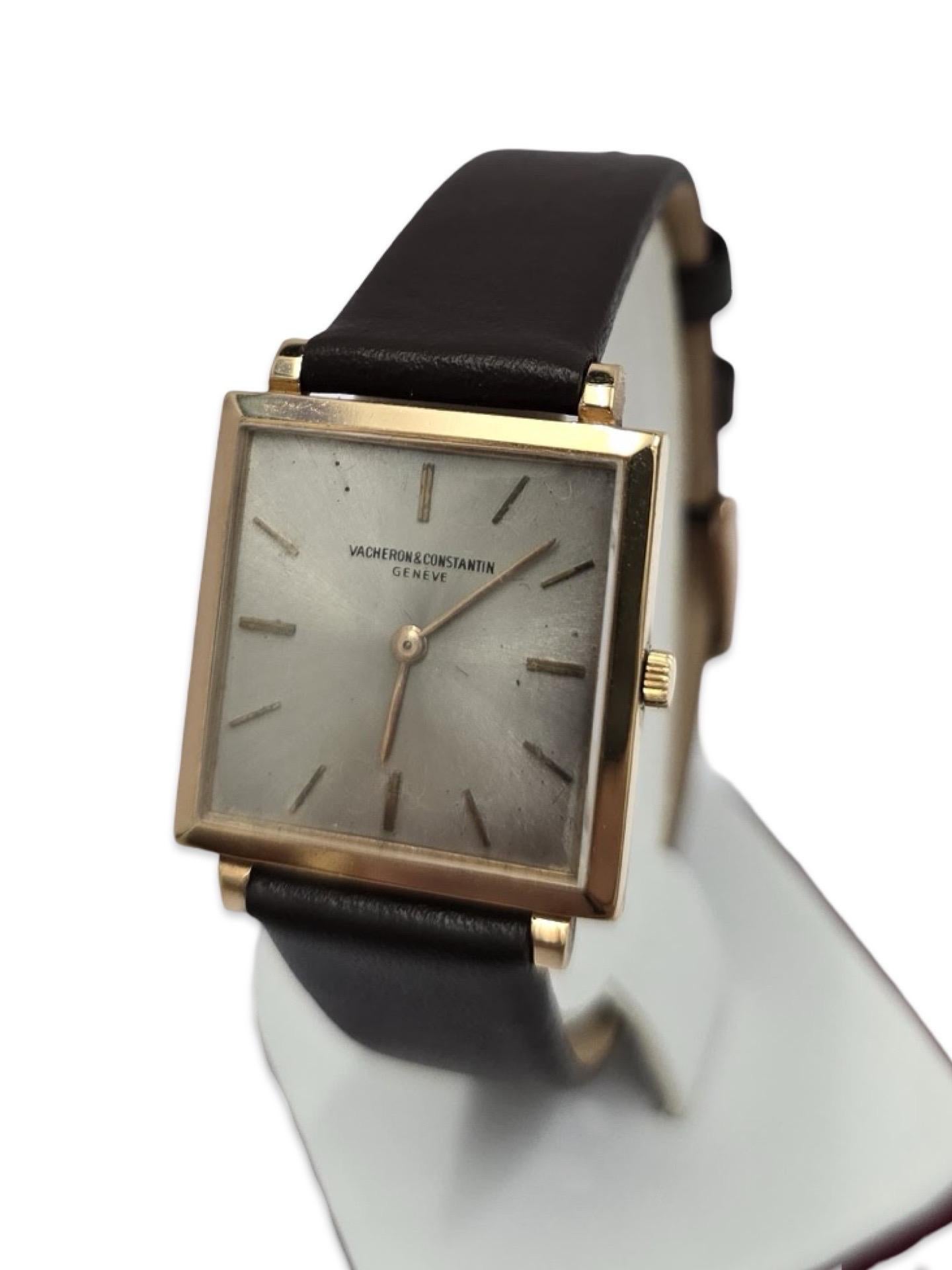A rare and elegant timepiece from the golden age of Swiss watchmaking, this Vacheron & Constantin Genève Ref. 6290 features a square case crafted from solid 18K gold, measuring 25.4mm wide (excluding crown). The minimalist silver-tone dial and baton
