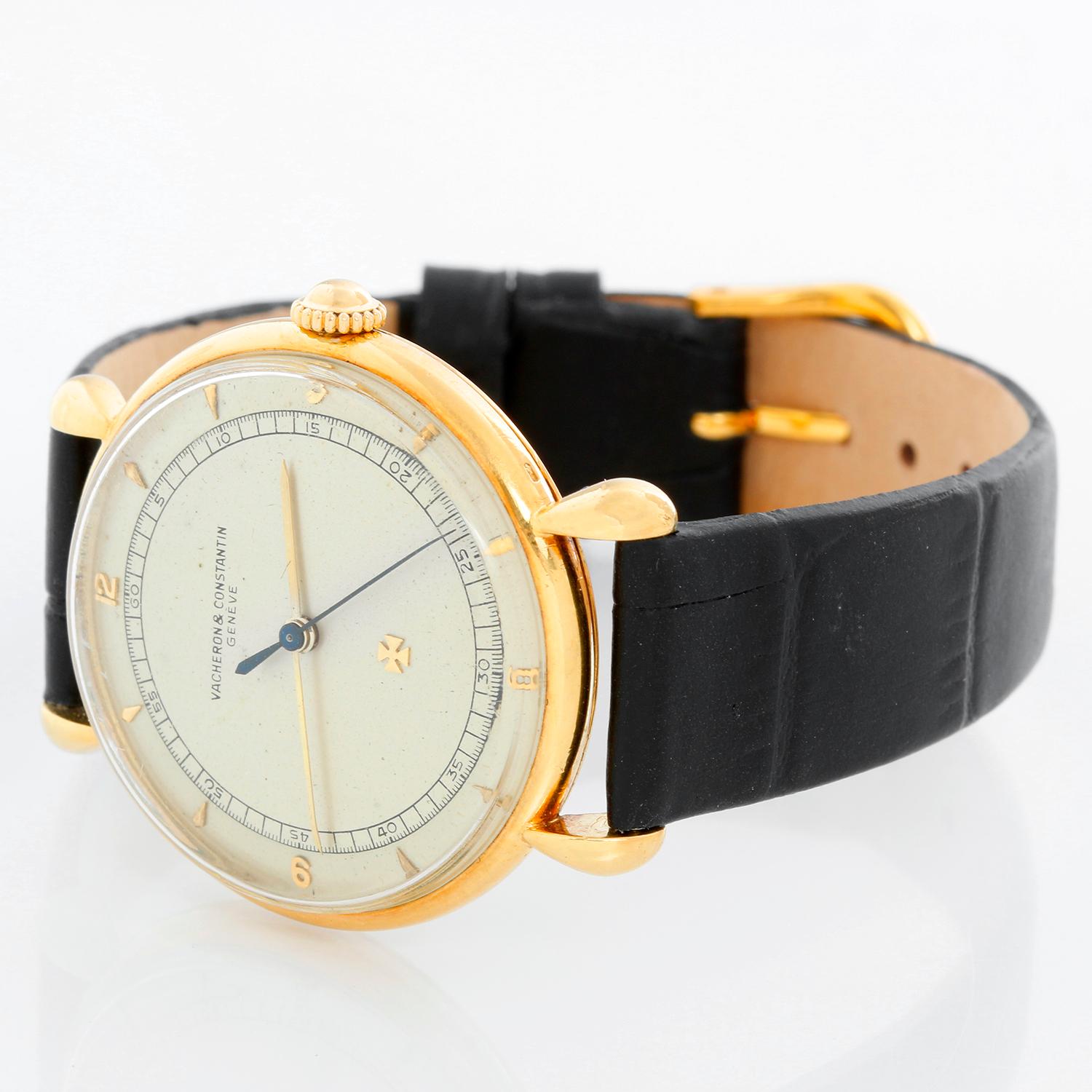 Vintage Vacheron Constantin 18k Yellow Gold Men's Watch - Manual winding. 18k yellow gold case (36 mm diameter). Silver dial with stick markers. Black leather strap with tang buckle. Vintage, pre-owned, with custom box.