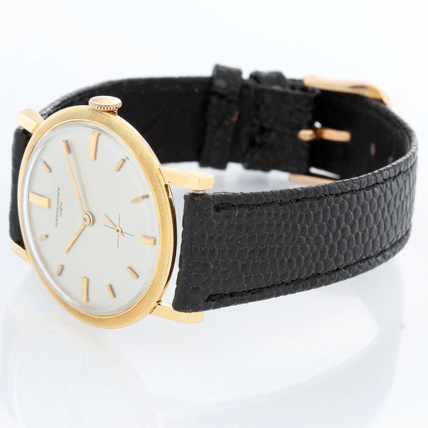 Vintage Vacheron Constantin 18k Yellow Gold Men's Watch - Manual winding. 18k yellow gold case (32mm diameter). Silver dial with stick markers. Black leather strap with tang buckle . Vintage, pre-owned, with custom box. Circa 1950's-60's.