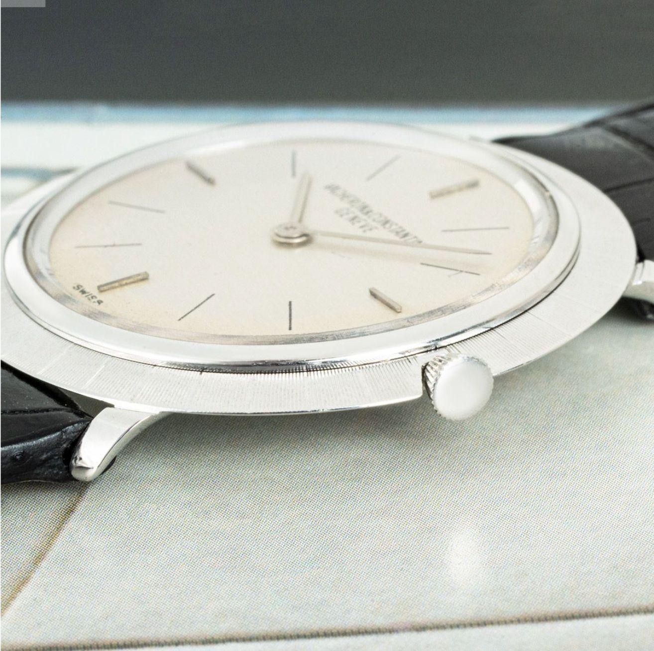 An Ultra Thin 33mm Vacheron Constantin crafted in white gold. Featuring a silver dial and a white gold bezel.

Equipped with a black generic leather strap and steel pin buckle. The watch is fitted with a plastic glass and a manual winding
