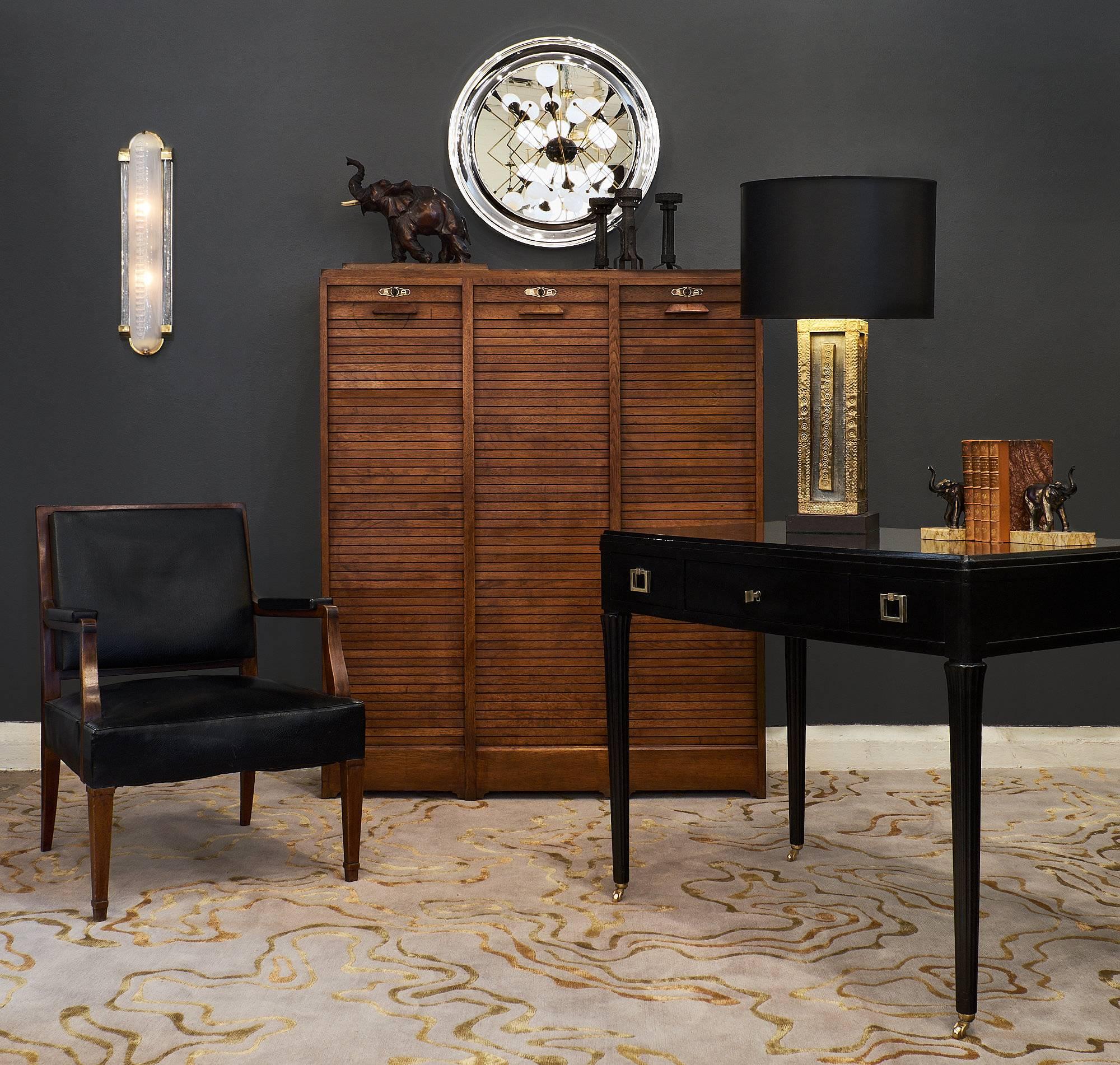 Spanish vintage lamp of hammered brass and pewter wrapped on wood of a rectangular shape and resting on a square wooden base. We loved the organic feel of the metal veneer, the primitive aesthetic of the craftsmanship, and the overall modernity of