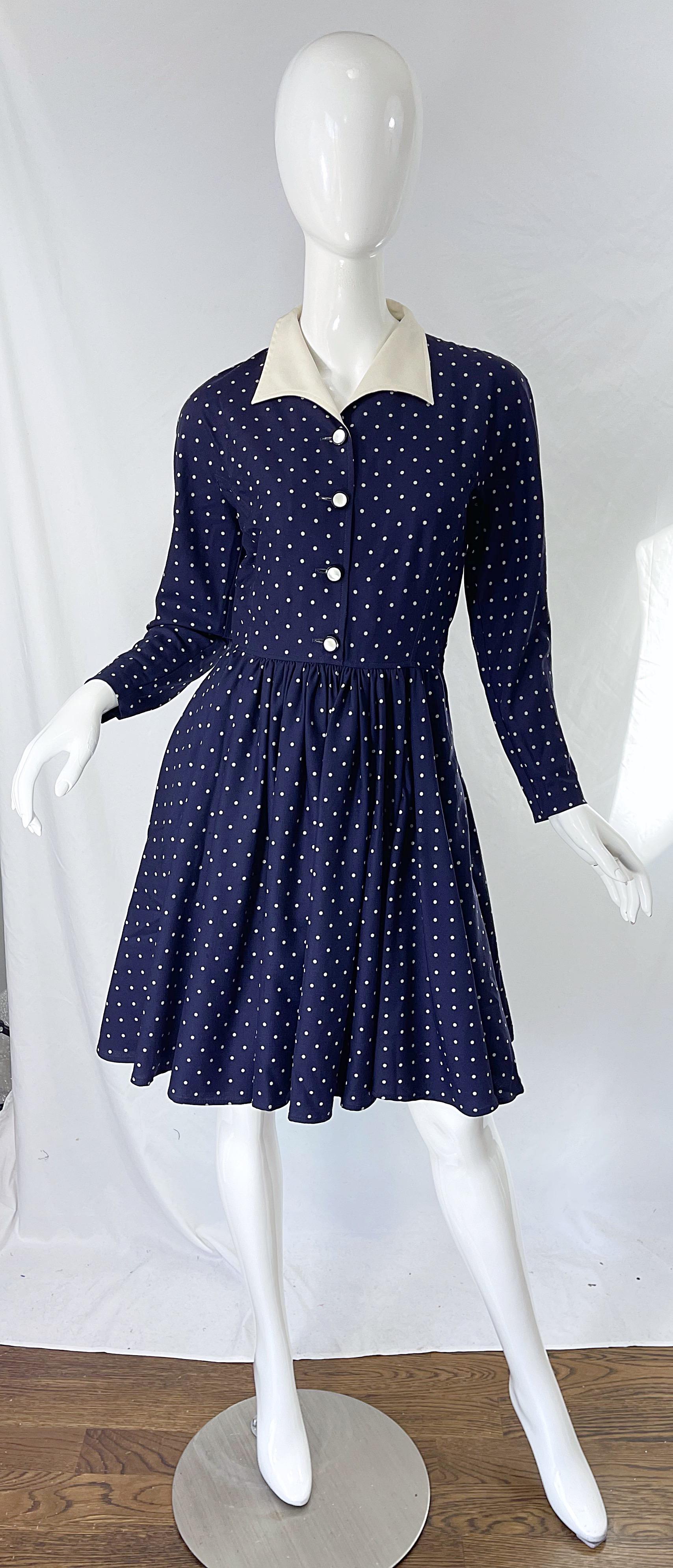 Chic 90s does 40s vintage VALENTINO navy blue and white polka dot silk blended long sleeve dress ! Features a curved notch collar with a tailored bodice and flirty forgiving skirt. Pockets at each side of the hips. Hidden zipper up the side, and