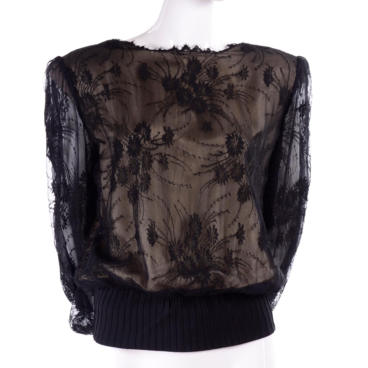 This is an incredible Valentino boutique vintage top with black lace overlay on a nude silk. The blouse almost has the fit of a sweatshirt so it is very comfortable but so elegant! 
 The sleeves have two layers of lace, and are sheer. It has eyelash