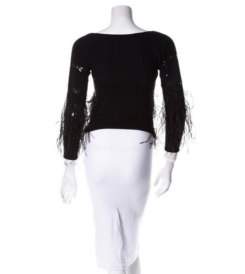 Vintage Valentino Black Sequin and Feather Embellished Knit Top Set
Consists of a Tank Top and Bolero
Top size - M, Bolero size - S.
Top Measurements: Length - 19.5 inches + feathers, Bust - 32/34