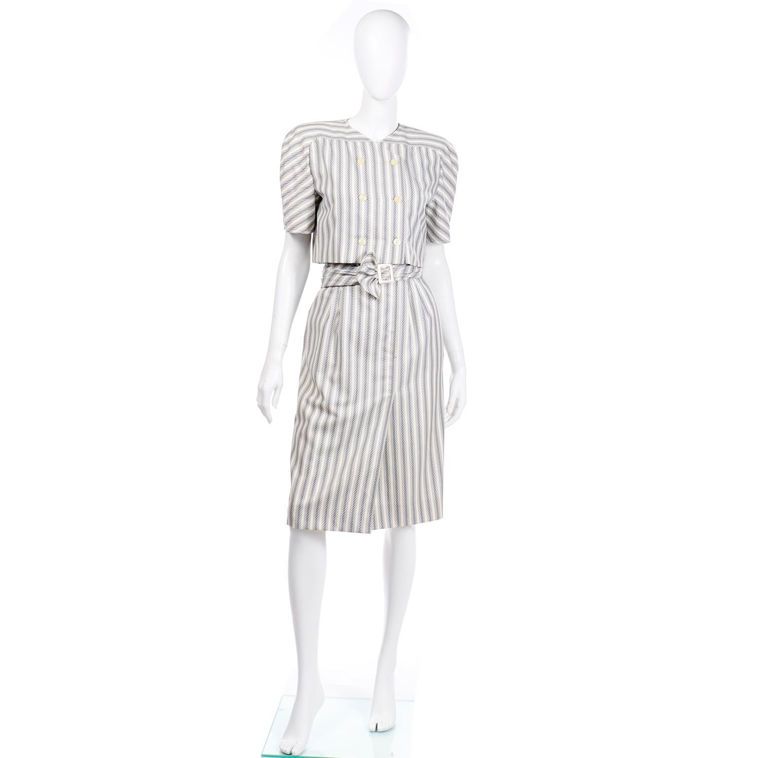 This incredible vintage early 1980's Valentino outfit includes a wonderful day dress with an attached double breasted short jacket, and a terrific one size open front jacket with the original matching belt.  This beautiful ensemble is in excellent