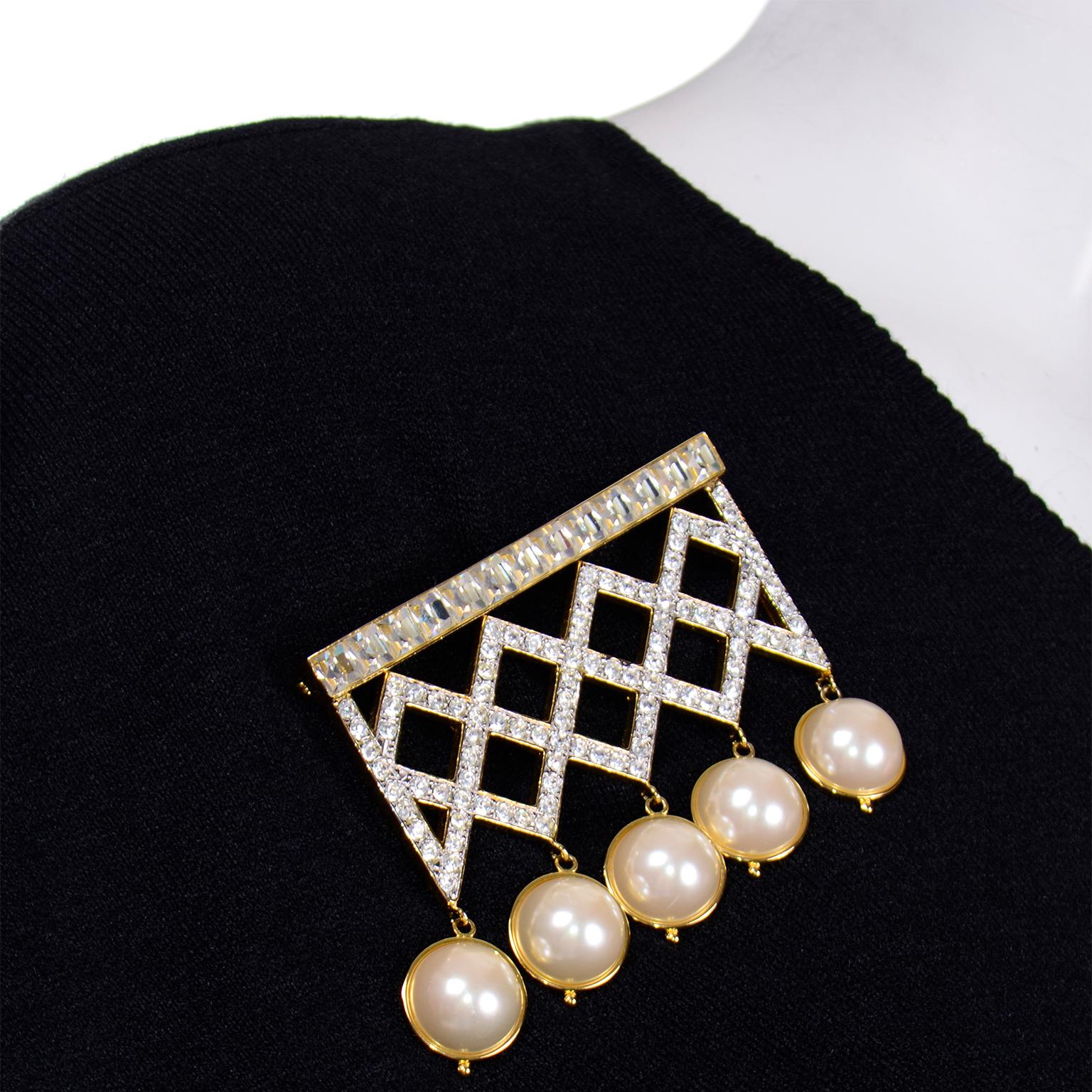 This is a stunning vintage Valentino Garavani gold tone crystal and faux pearl large rectangular brooch with a double pin back. There is a large pin laying horizontally across the back and a center pin to support the weight and size. This brooch has