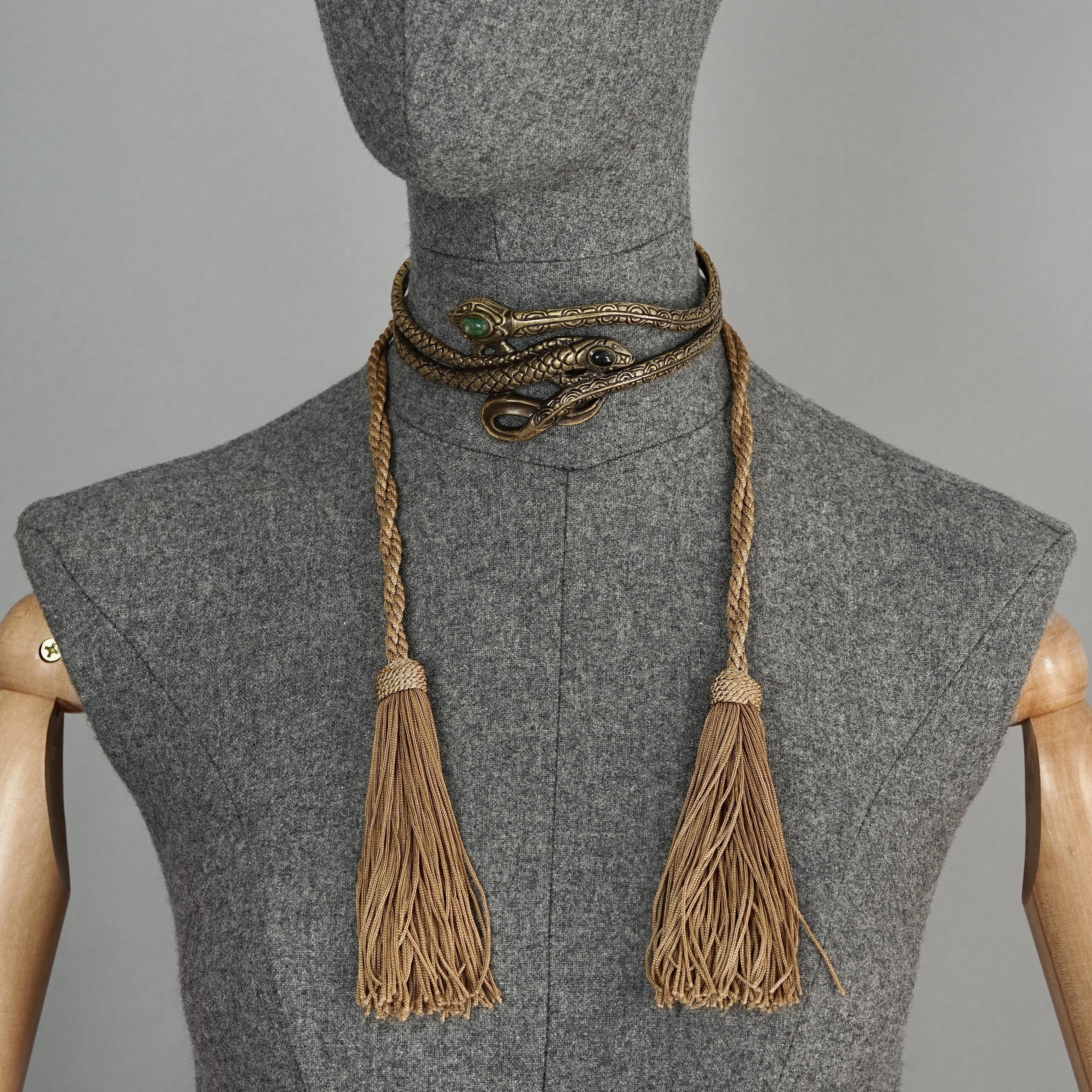Vintage VALENTINO GARAVANI Snake Tassel Choker Necklace

Measurements:
Height: 2 inches (5.1 cm)
Tassels: 11.81 inches (30 cm)
Chain: 13.07 inches (33.2 cm) could be adjusted a little bit (+/-)

Features:
- 100% Authentic VALENTINO.
- Impressive