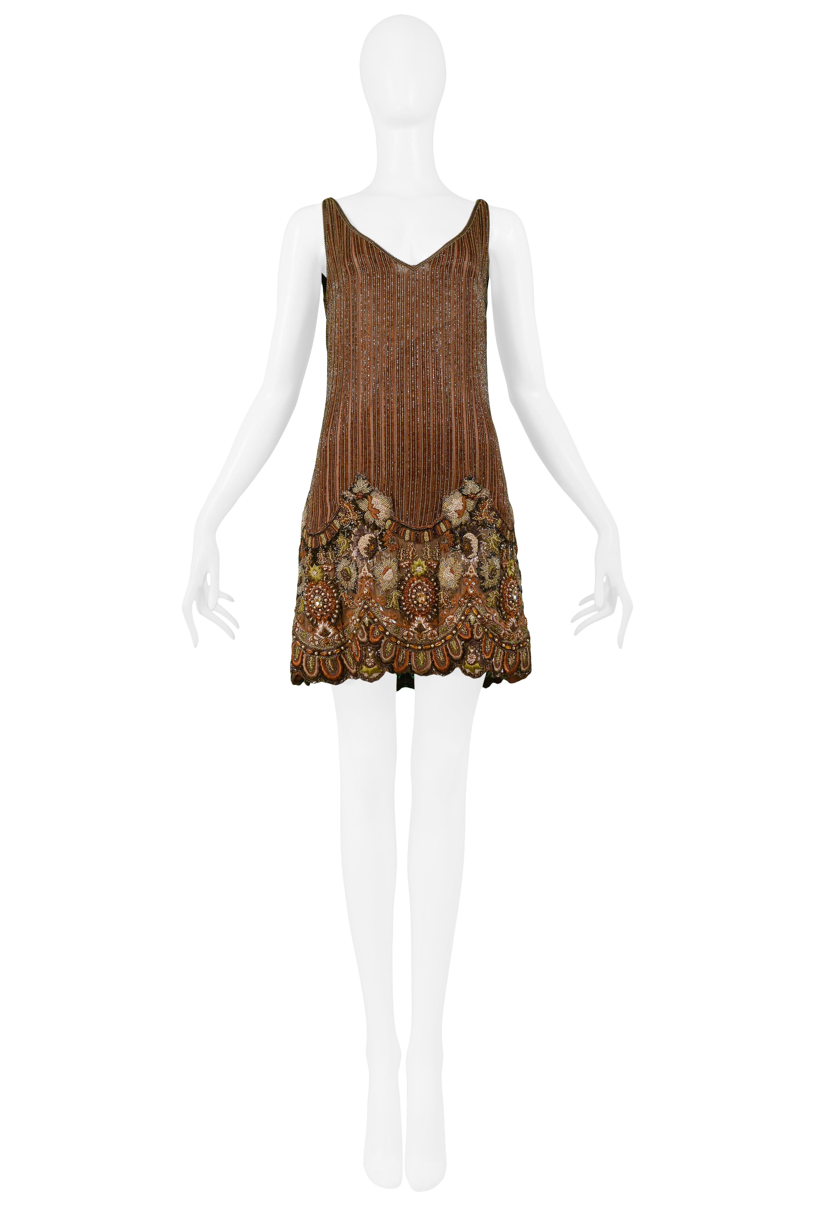 Resurrection Vintage is excited to offer a vintage Valentino caramel brown tank dress with a v-neckline, low cut back, and striped beading with intricate green, rust & caramel brown floral beadwork at the hem, and a center back