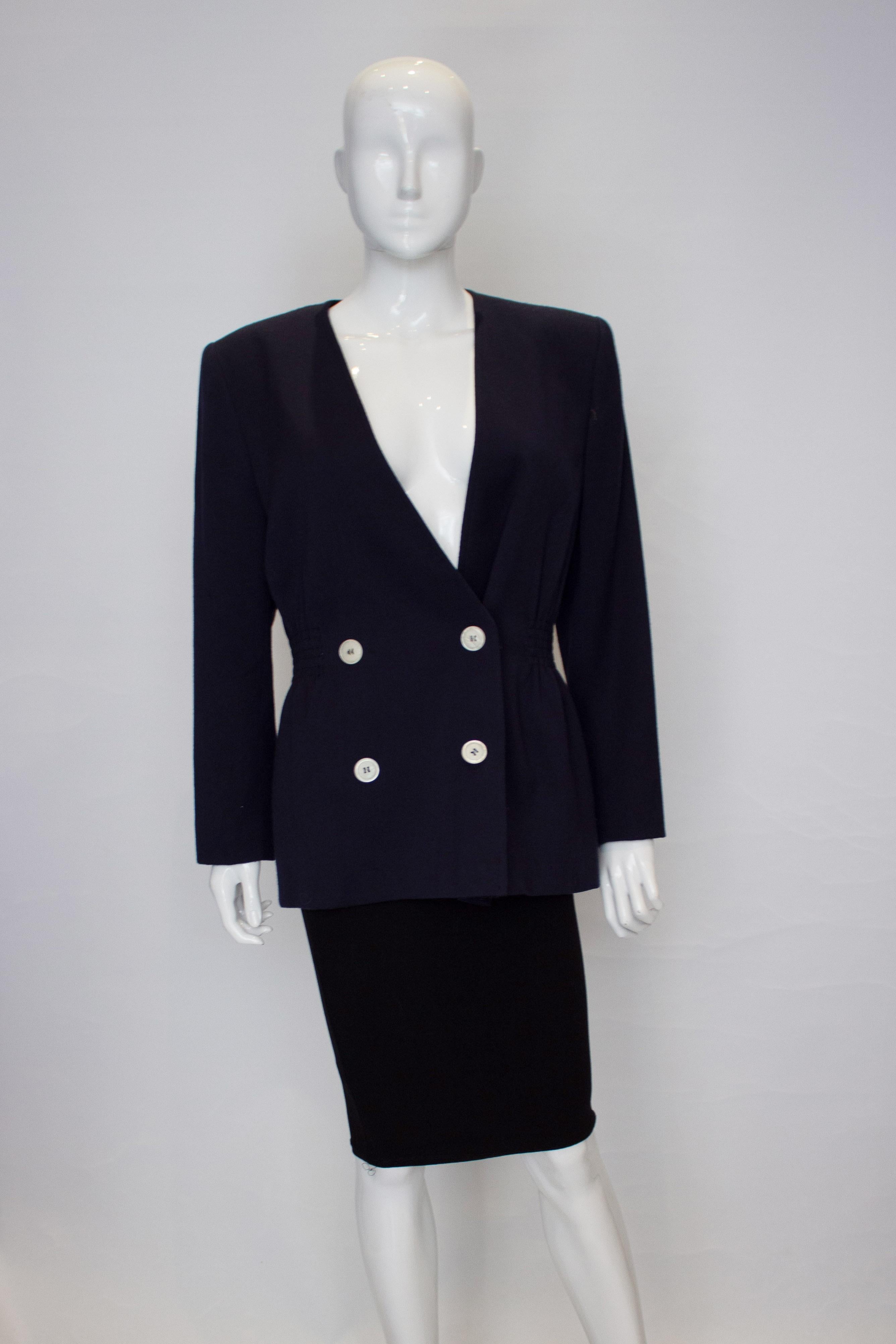 A great vintage wool jacket by Valentino, Miss V line. The jacket  has a four button opening, elastic gathering on both sides and is fully lined. 