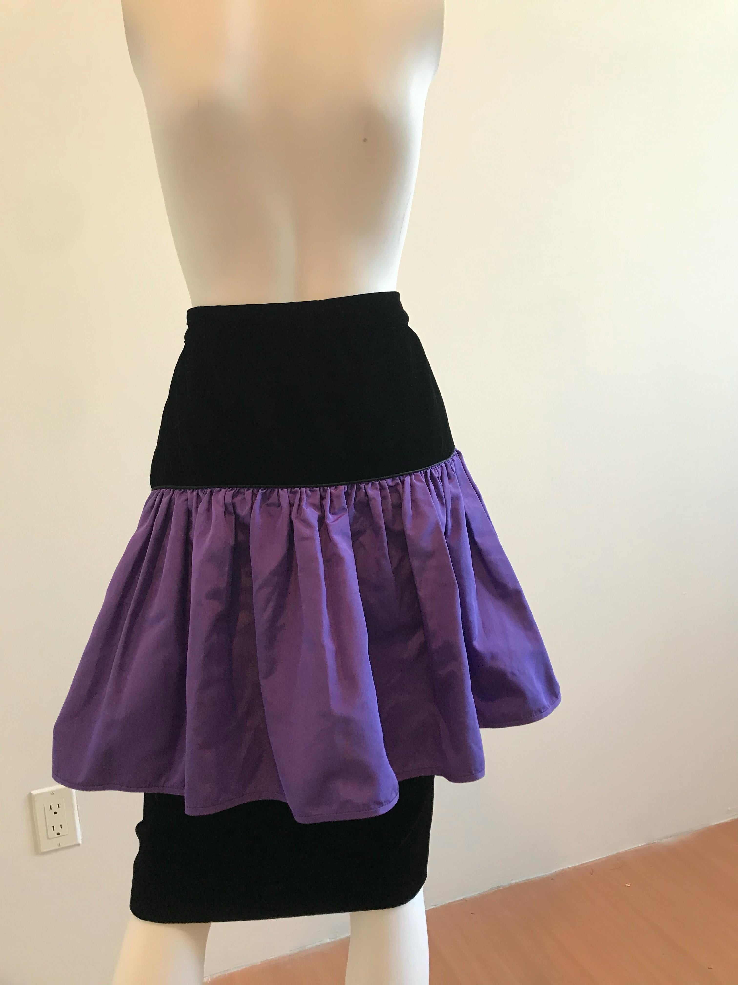 Dating between 1986-1991 this Valentino Night skirt has an opulent black velvet skirt with a vibrant silk taffeta. This florescent band adds a punch of excitement to the color scheme of the dress. This dress is a beautiful vintage piece that makes