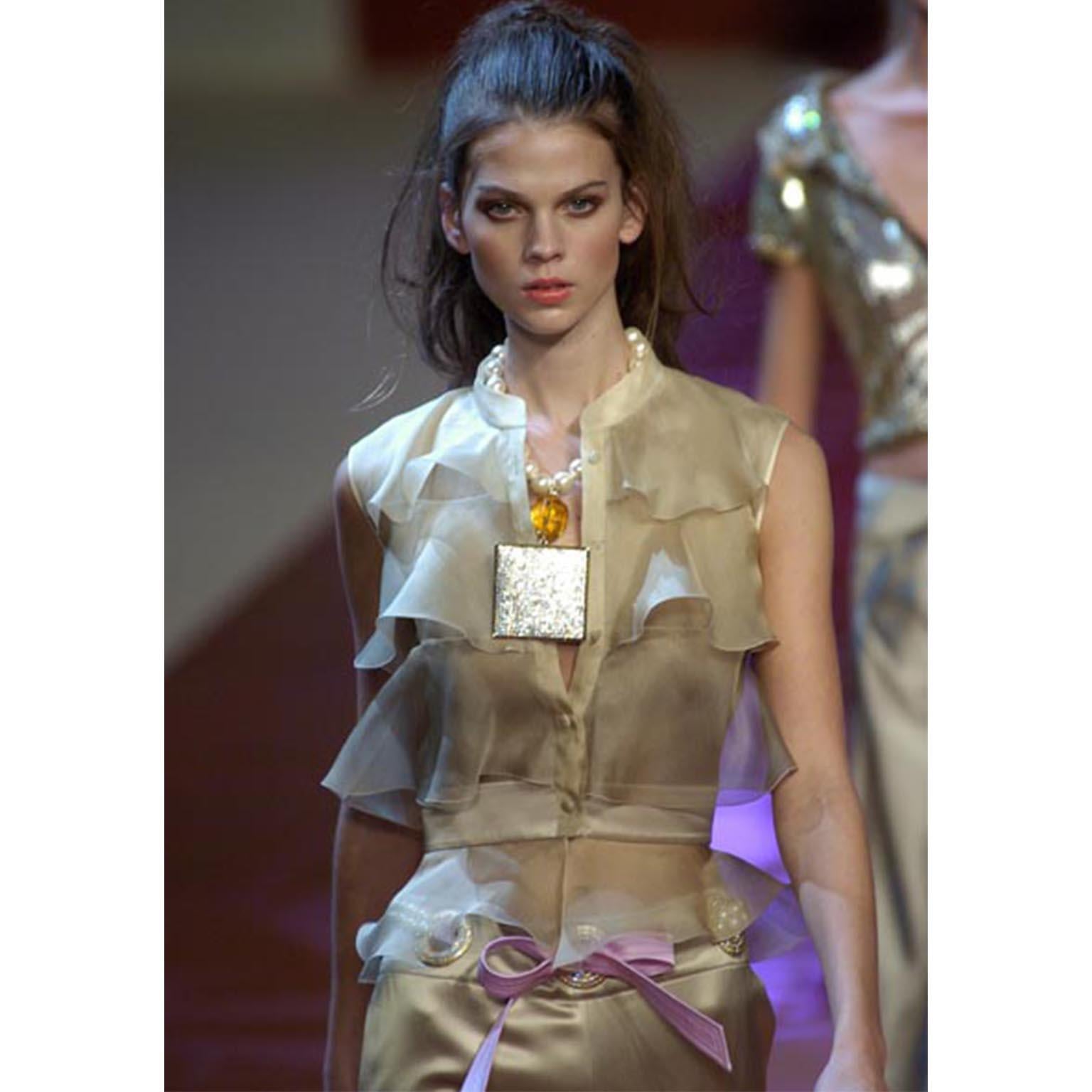 This is a stunning Valentino Spring Summer 2005 silk organza sleeveless blouse in muted shades of green, with a slight ombré effect. Each tier has a different shade with it being lightest at the top and darkest at the bottom and then the very last