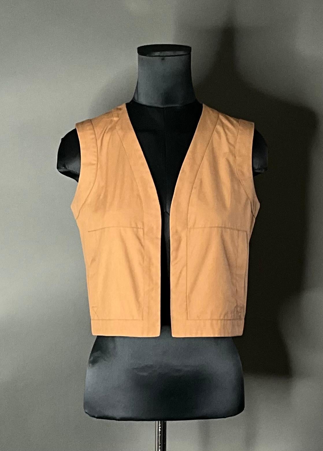 A Vintage Valentino Vest is a classic, elegant piece that showcases the designer’s impeccable craftsmanship and timeless style. With its tailored silhouette, luxurious fabric, and refined details, this vest is a versatile addition to any wardrobe.
