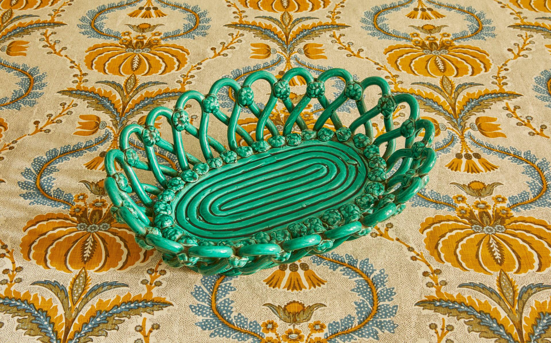 France, 1940s.

Vallauris woven ceramic basket in green glaze.

Measures: H 9 x W 30 x D 22 cm.