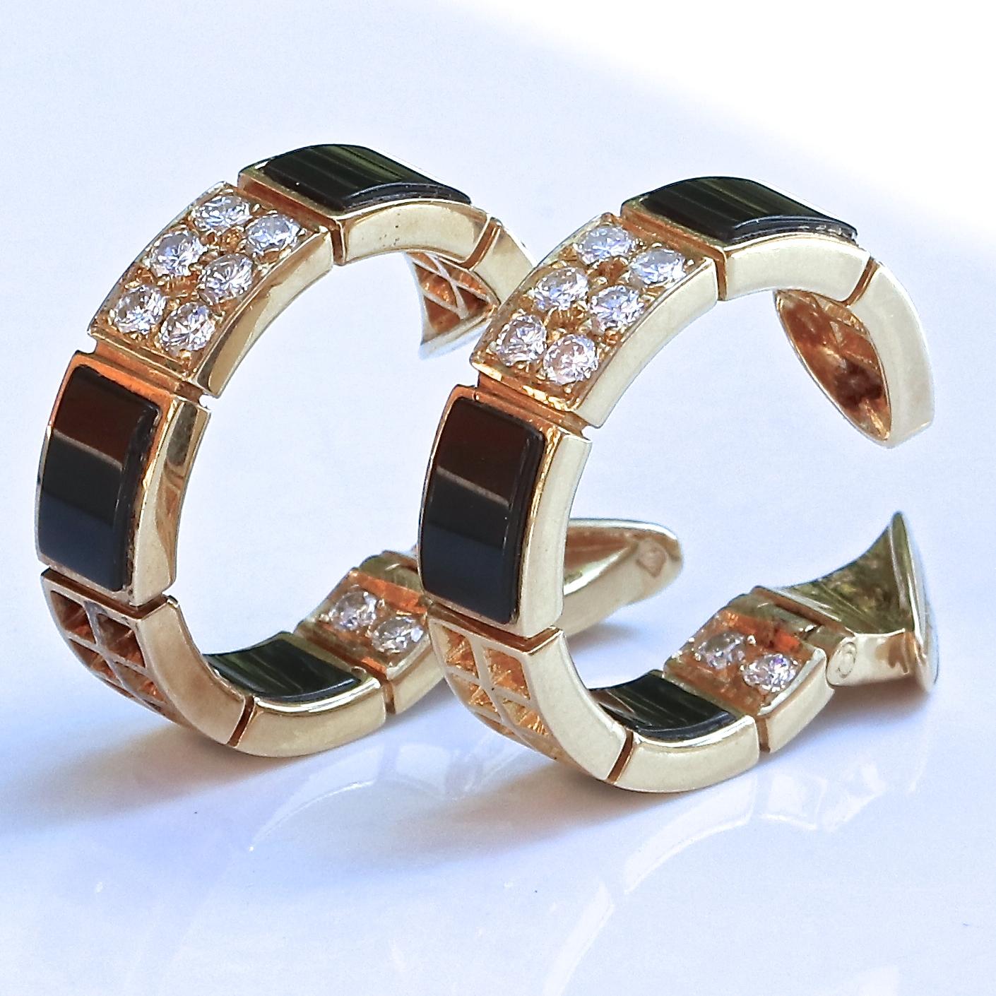 Vintage Van Cleef & Arpels diamond and onyx hoop earrings. Circa 1977 and featuring 38 round brilliant diamonds that weigh approximately 2.44 carats, graded E-F color, VVS clarity. Signed VCA serial #C3101X2. 