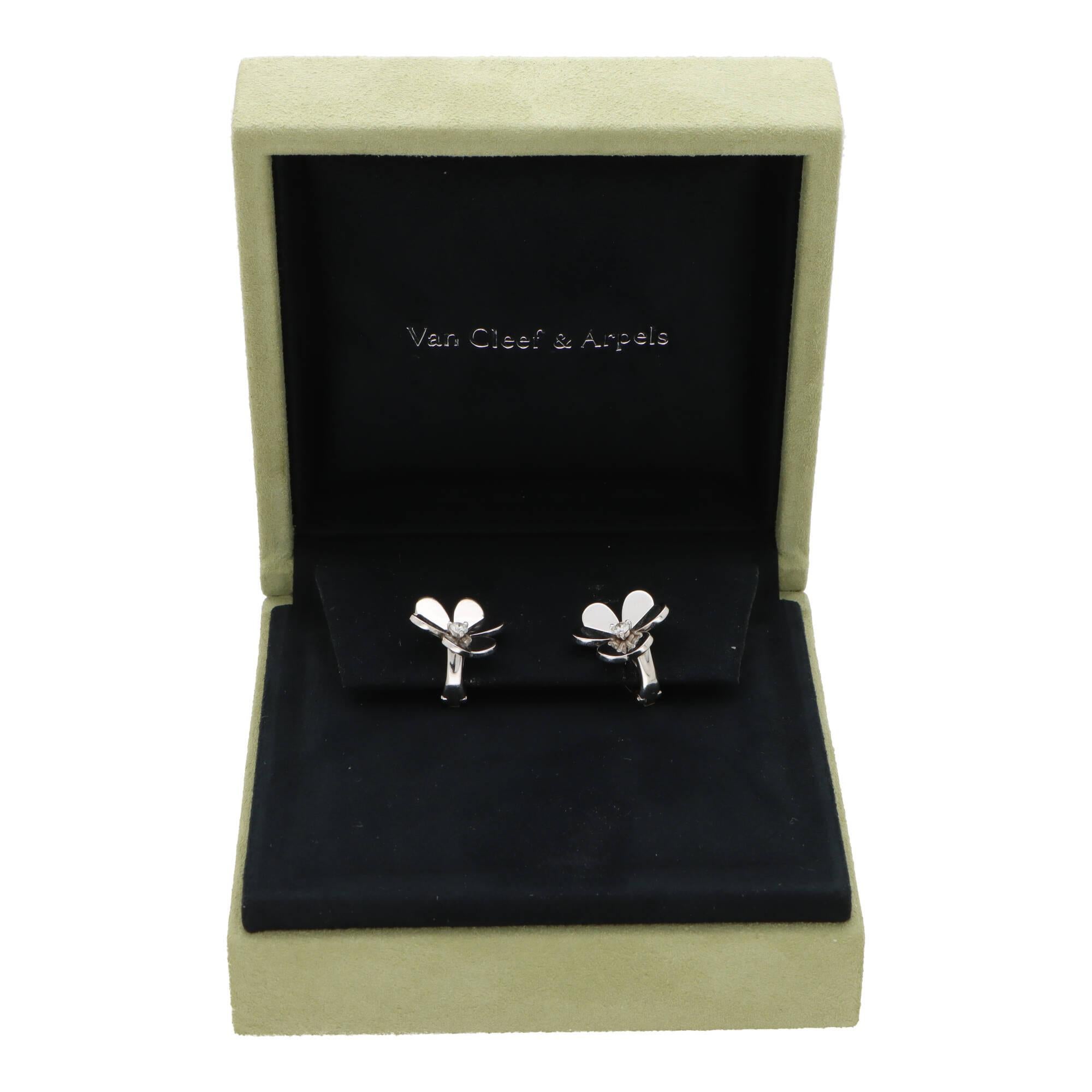 An iconic pair of vintage Van Cleef and Arpels Frivole earrings set in 18k white gold.

Each earring depicts the recognisable Frivole three leaf clover motif each set centrally with a round brilliant cut diamond. The earrings are secured to reverse