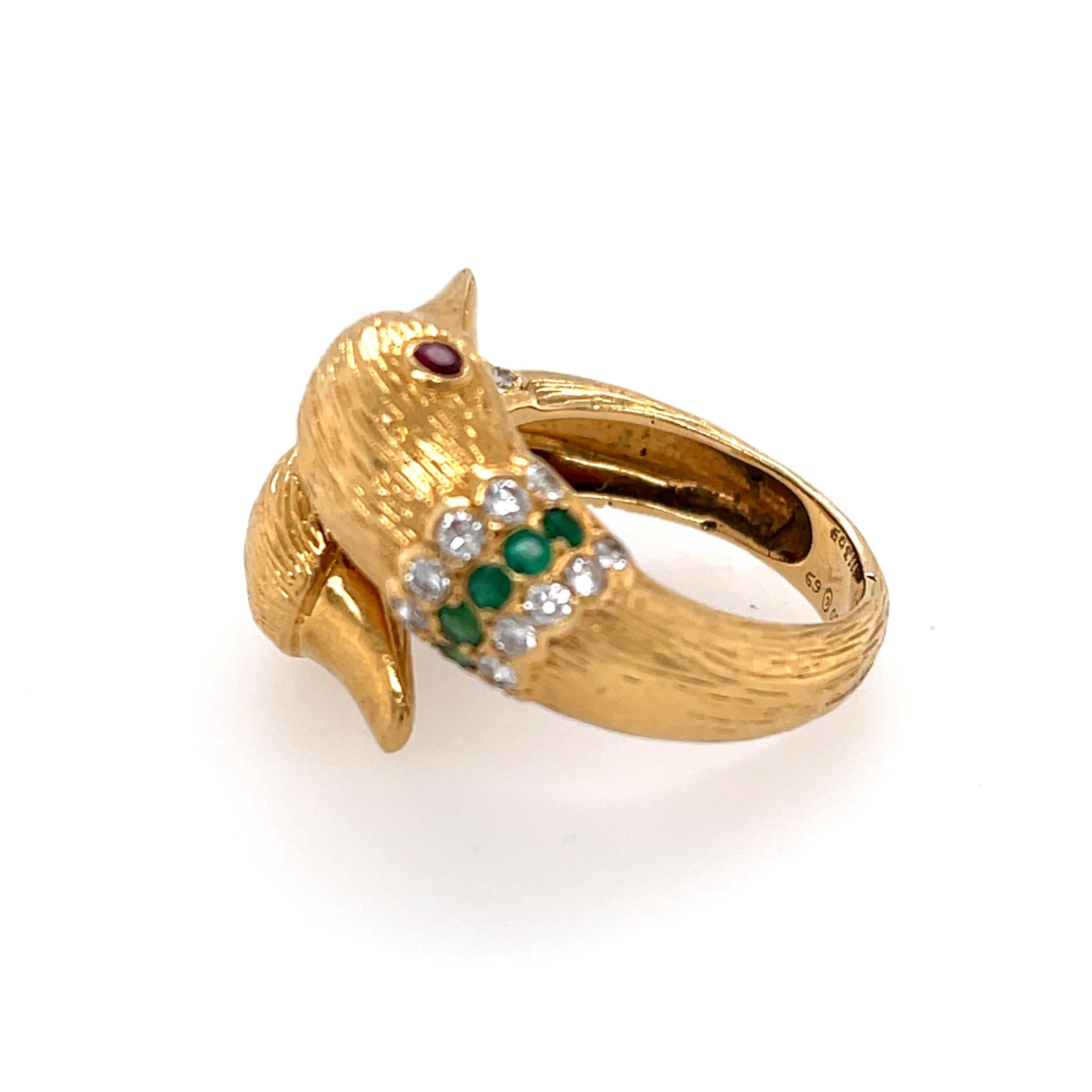 A fine vintage 18k yellow gold emerald and diamond bypass ring made by Van Cleef & Arpels circa 1970. This interesting ring has two duck heads with ruby eyes. We have seen this model made in fluted coral as well. This is the all gold version. The