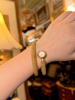 Reloj brazalete vintage Van Cleef & Arpels de oro de 18 quilates con manguito en espiral