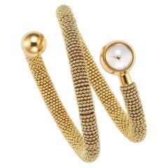 Reloj brazalete vintage Van Cleef & Arpels de oro de 18 quilates con manguito en espiral