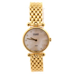 Van Cleef & Arpels Montre-bracelet vintage pour femme en or 18 carats, nacre et diamants