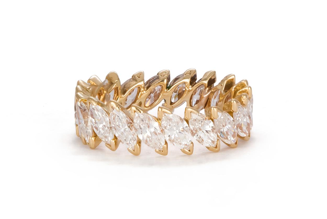 We are pleased to offer this beautiful Vintage Van Cleef & Arpels 18k Yellow Gold & Diamond Eternity Ring. This stunning piece from VCA features an estimated 3.00ctw E-F/VVS2-VS1 Marquise Cut Diamonds. The ring is a size 4.5, it is in very good