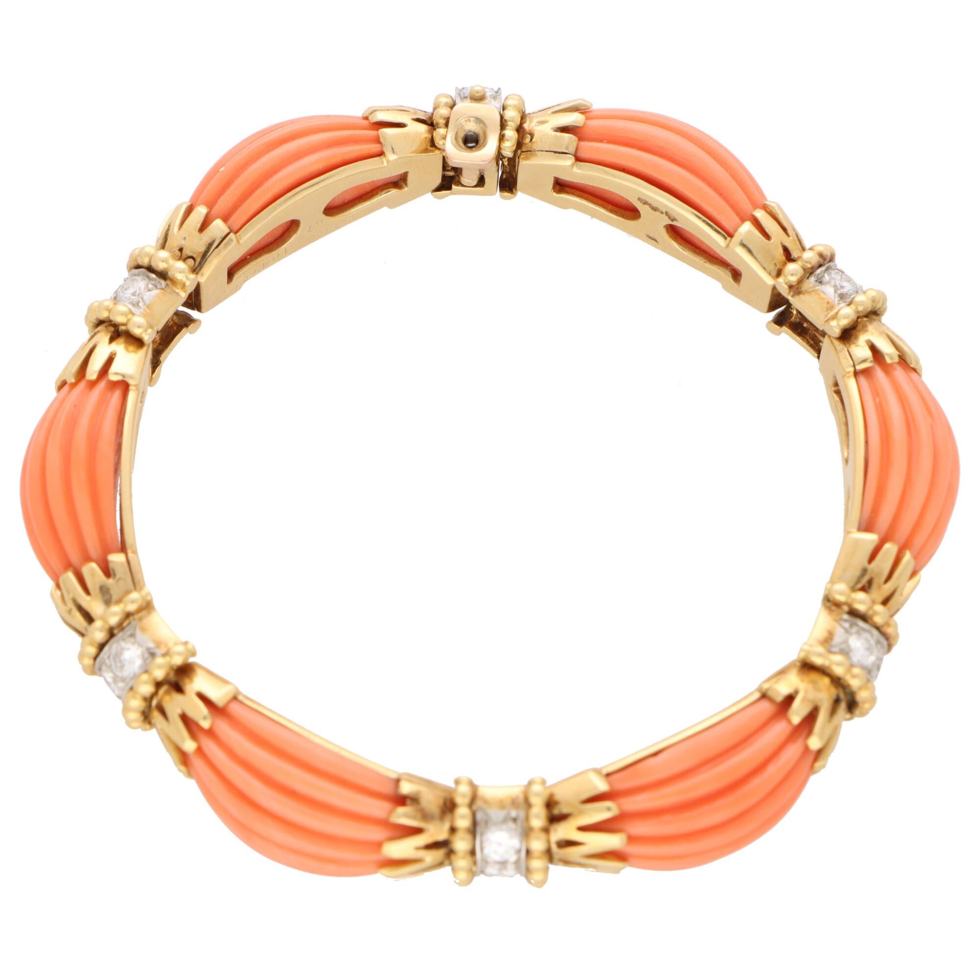 - May require a CITES upon importation. Please inquire to 1st dibs -

A beautiful vintage Van Cleef & Arpels coral and diamond bracelet set in 18k yellow gold and platinum.

The bracelet is designed as a continuous row of fluted oval coral cabochon