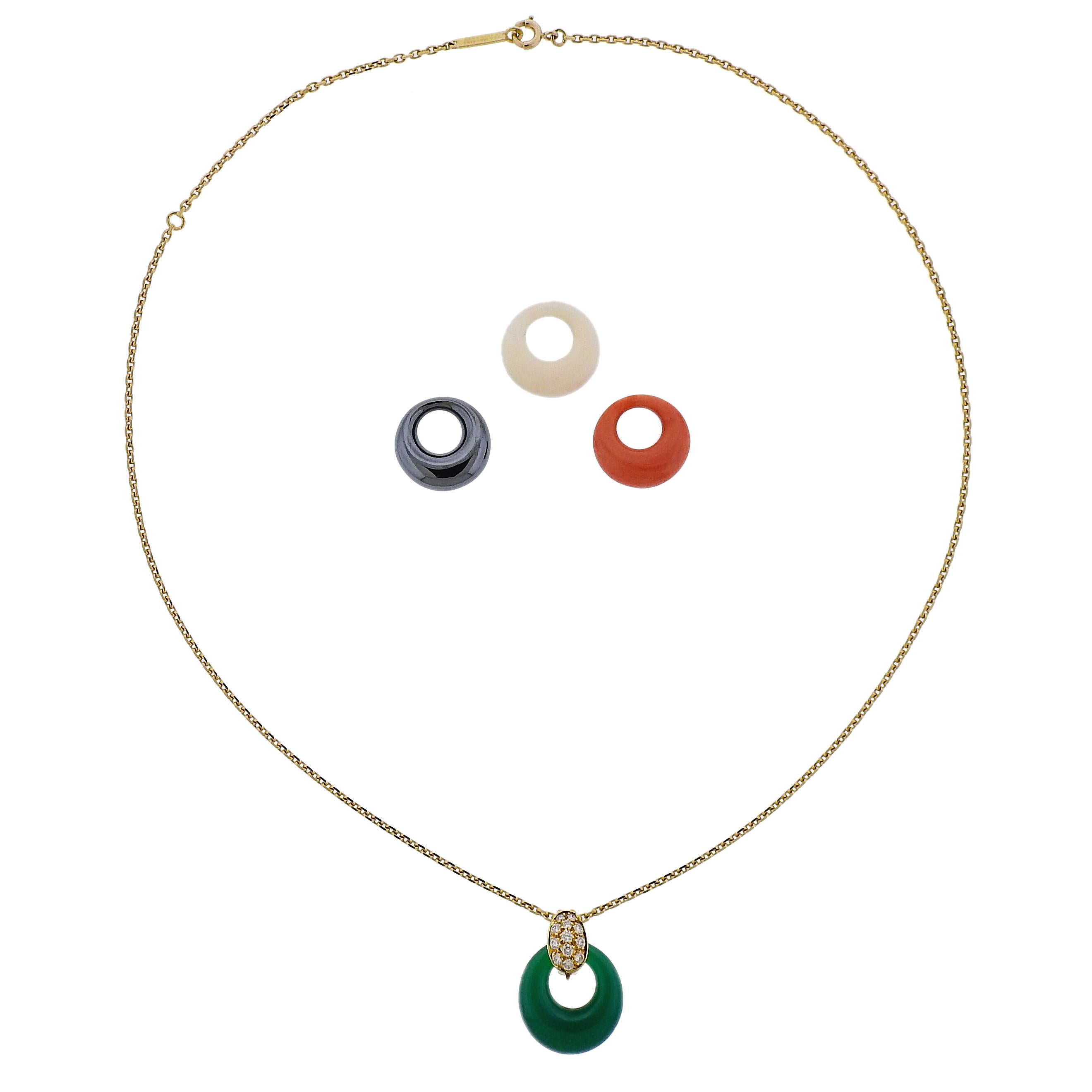 Vintage 18k yellow gold necklace by Van Cleef & Arpels, featuring interchangeable pendant. Set with approx. 0.20ctw in FG/VVS diamonds and three gemstones: coral, chrysoprase and hematite. Necklace is 18