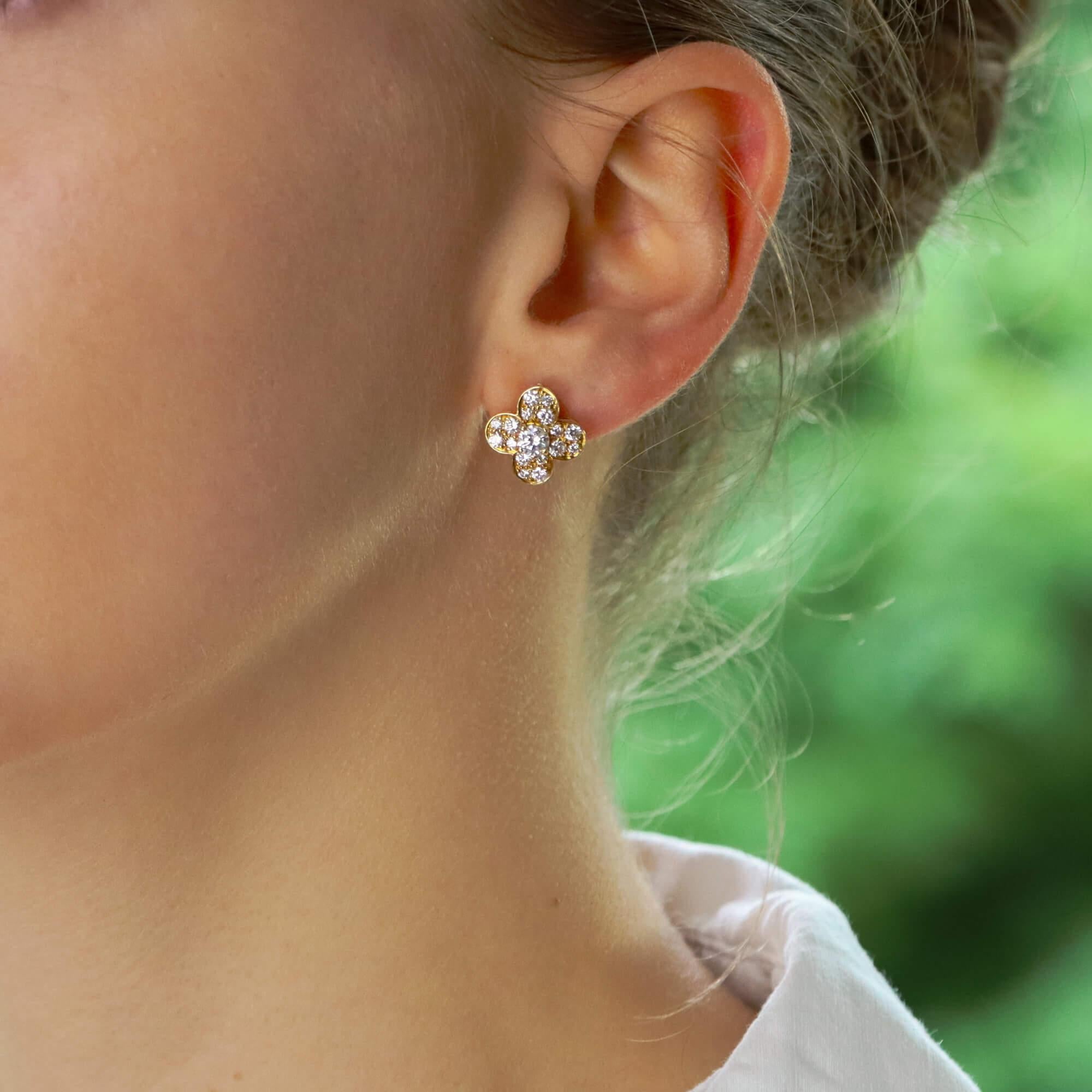  A beautiful pair of vintage Van Cleef and Arpels Trefle diamond earrings set in 18k yellow gold.

Each earring depicts the iconic Van Cleef clover motif, also referred to as the Trefle design. Each earring is set centrally with a sparkly round