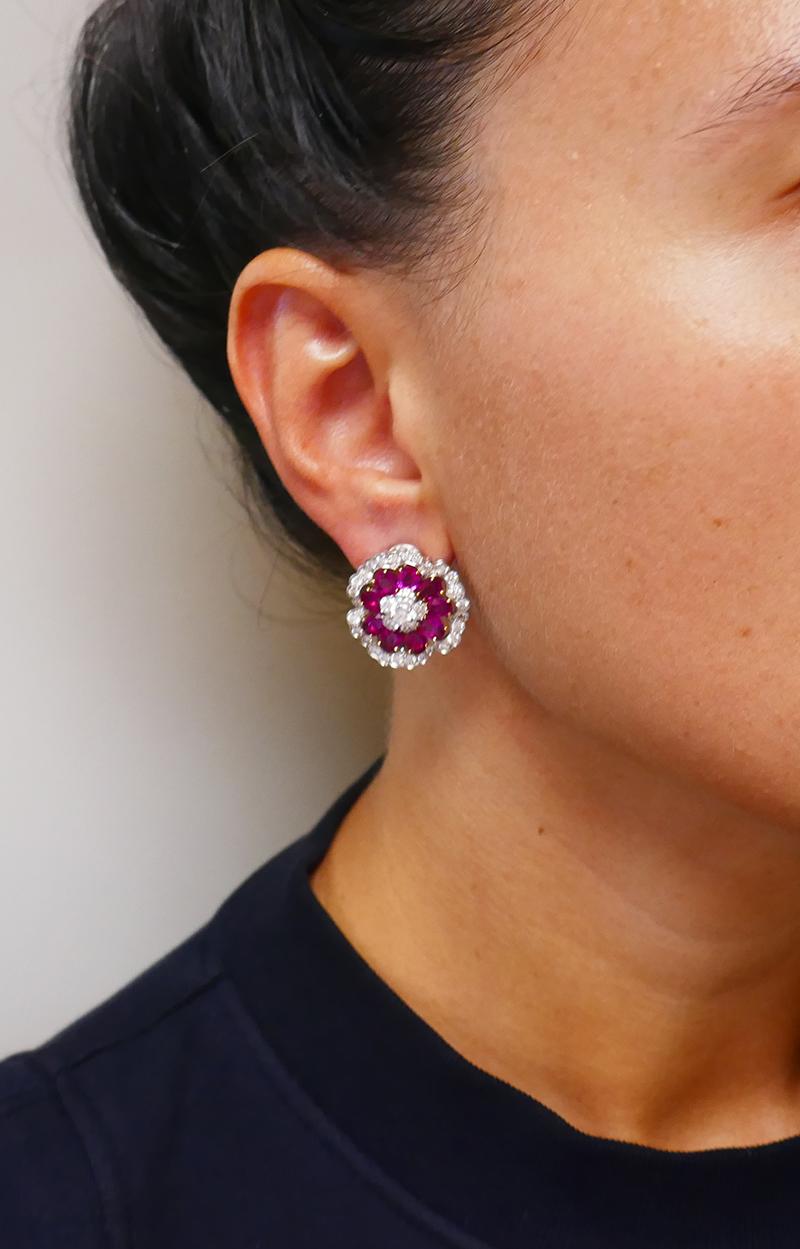         A pair of feminine vintage Van Cleef & Arpels earrings, made of platinum and 18 karat yellow gold, featuring ruby and diamond.
	These vintage VCA earrings were designed with top-notch quality in mind. Note an amazing open work and the