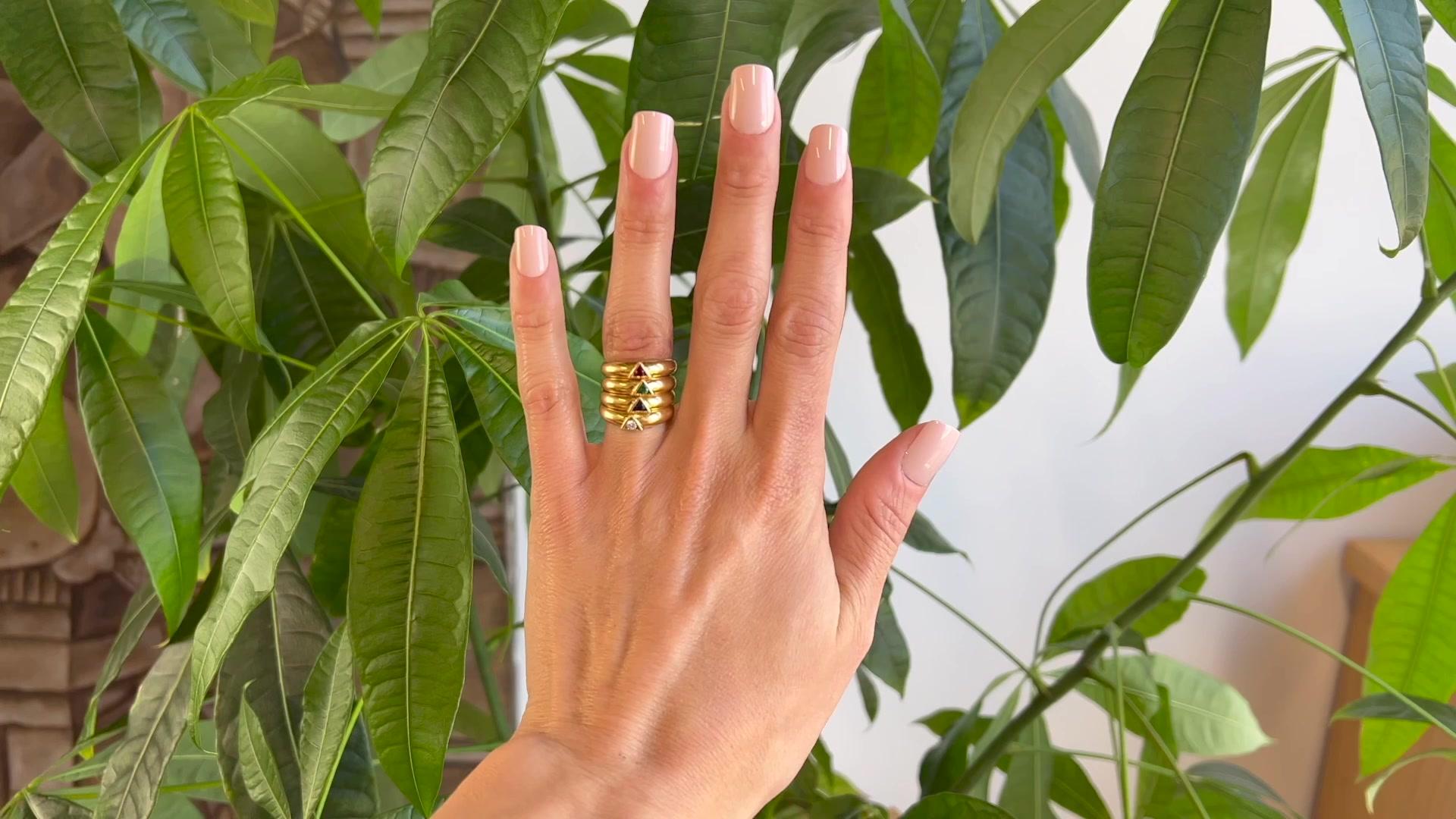 One Vintage Van Cleef & Arpels Gemstone 18K Yellow Gold Triangle Ring Set. Featuring one round brilliant cut diamond weighing 0.07 carat, graded D-E color, VVS clarity, one round brilliant cut sapphire weighing 0.11 carat, one round brilliant cut