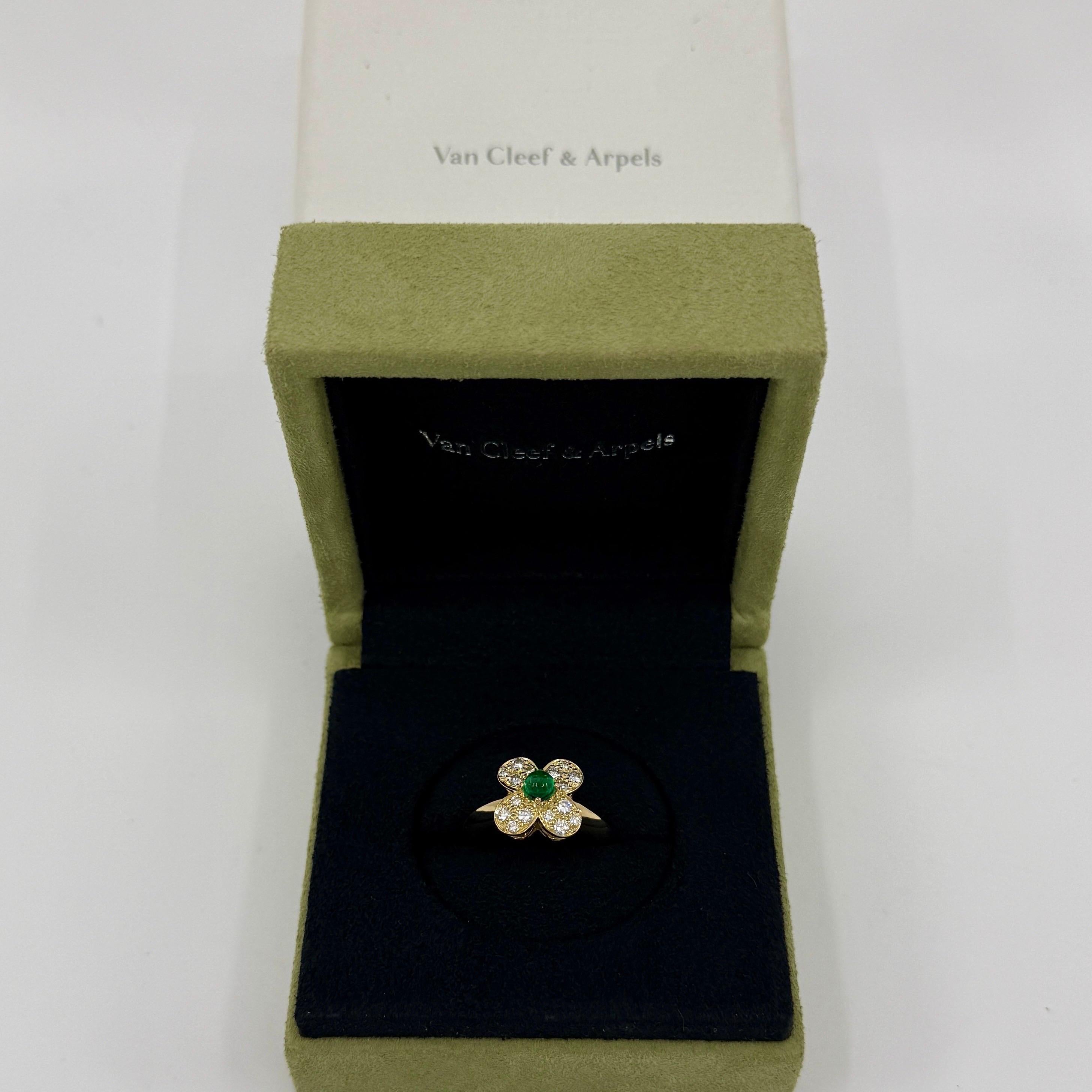 Fine Vintage Van Cleef & Arpels Emerald And Diamond 18k Yellow Gold Trefle Flower Ring.

A stunning vintage ring with a unique floral design typical of Van Cleef & Arpels, set with a beautiful natural round cabochon emerald and diamonds in a classic