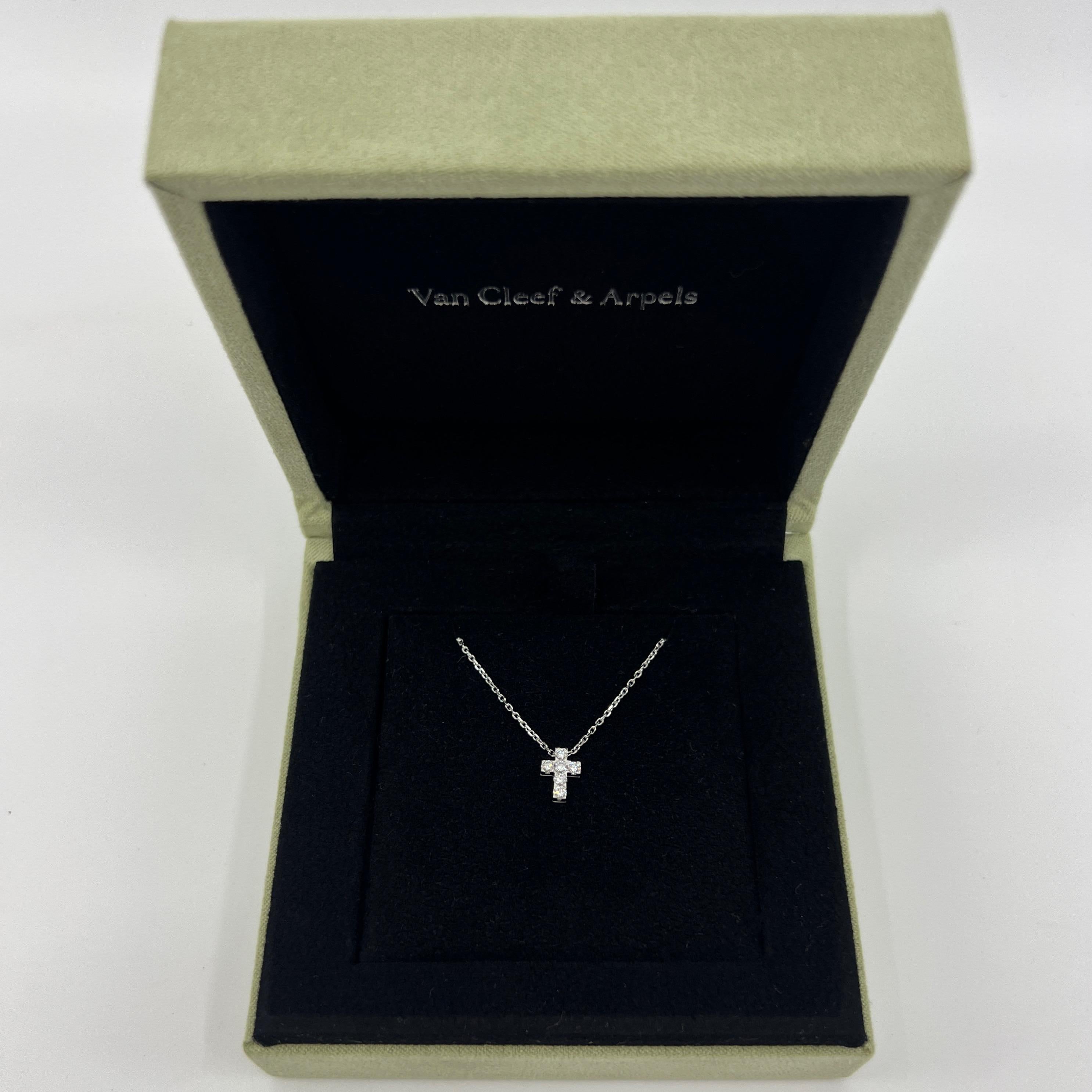 Vintage Van Cleef & Arpels Miniature Diamond Cross 18k White Gold Pendant Necklace.

A classic diamond-set mini cross pendant on a fine 18 karat white gold chain by Van Cleef & Arpels. 
The cross is set with x6 round brilliant cut diamonds of the