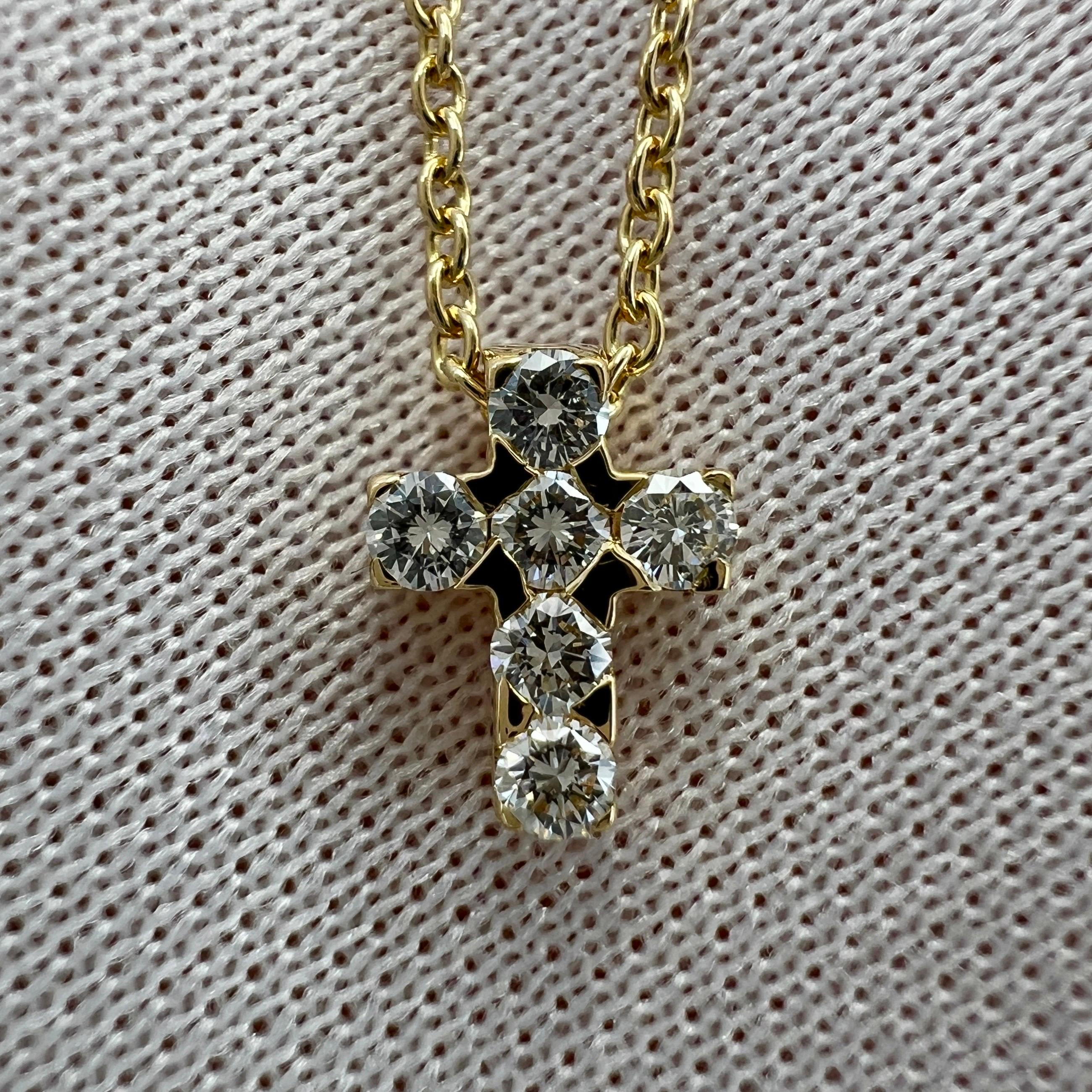 Vintage Van Cleef & Arpels Miniature Diamond Cross 18k Yellow Gold Pendant Necklace.

A classic diamond-set mini cross pendant on a fine 18 karat yellow gold chain by Van Cleef & Arpels. 
The cross is set with x6 round brilliant cut diamonds of the