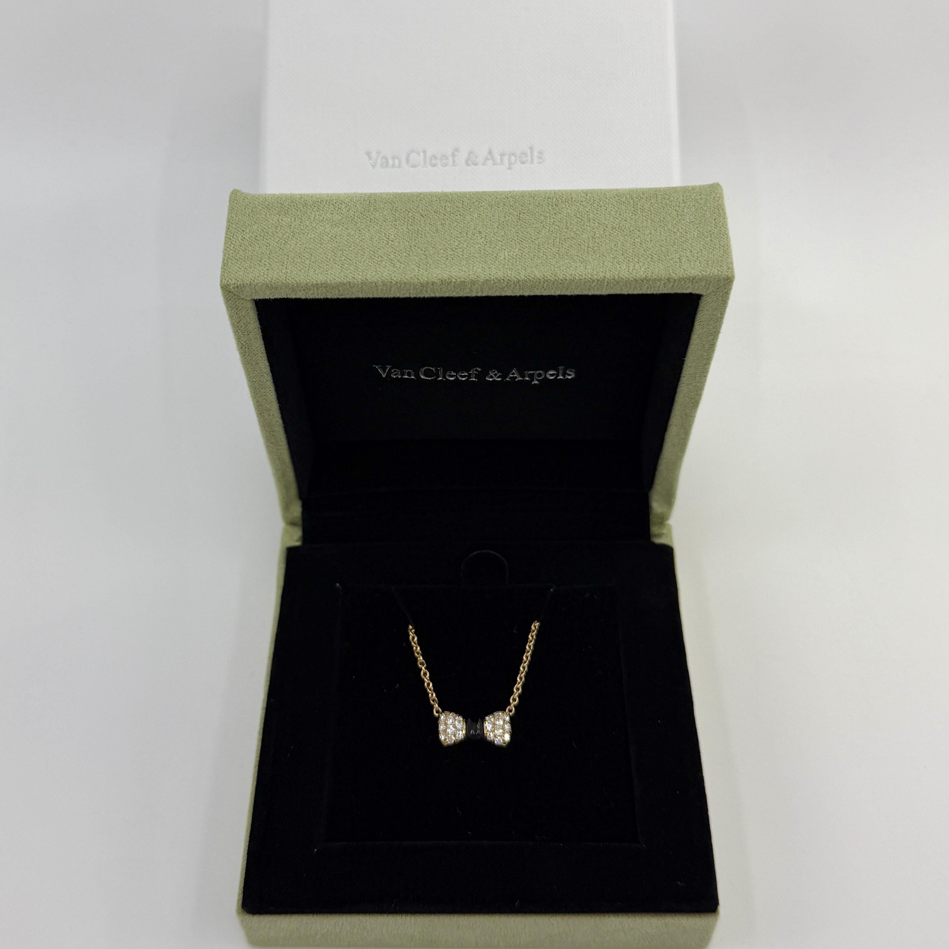 Rare Vintage Van Cleef & Arpels Onyx And Diamond 18k Yellow Gold Ribbon Bow Pendant Necklace.

A beautiful necklace with a unique design typical of Van Cleef & Arpels, set with a beautiful arrangement of onyx and top quality white diamonds.
The