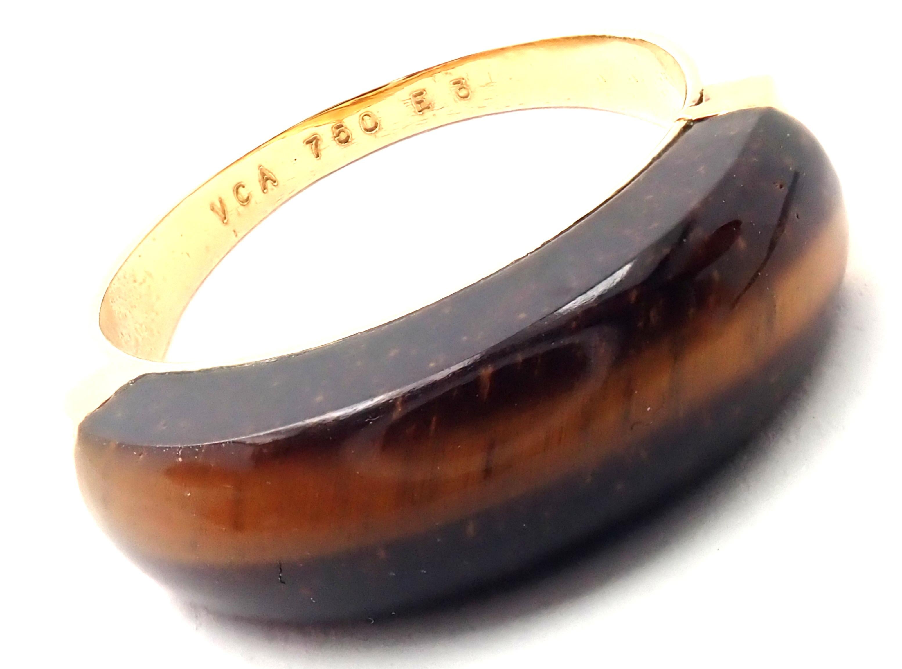18k Yellow Gold Tiger Eye Band Ring by Van Cleef & Arpels.
With 1 Tiger's Eye
Details: 
Size: 7 1/2 
Width: 7mm
Weight: 3.9 grams
Stamped Hallmarks: VCA 750 E3
*Free Shipping within the United States* 
YOUR PRICE: $2,800
T2965mhtd
