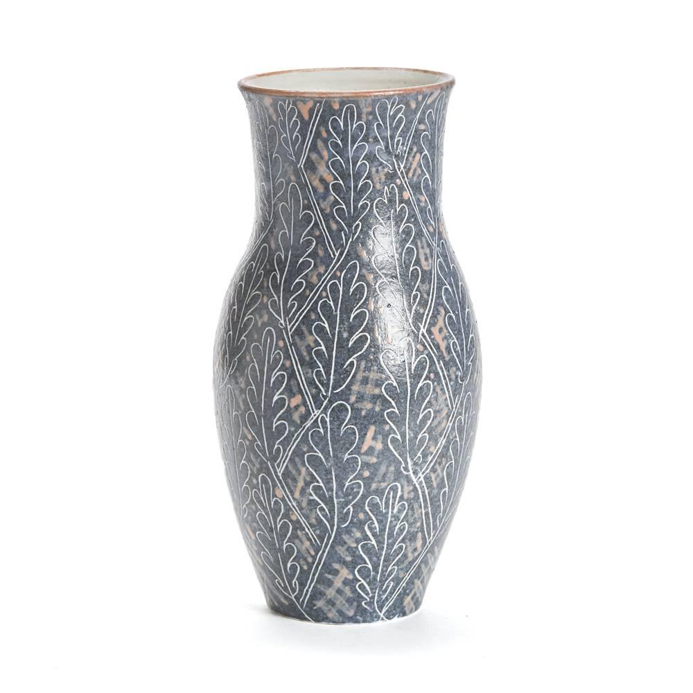 A stunning and scare vintage Van Der Straeten studio pottery vase decorated in a patterned grey body applied with an incised leaf design. Incised Van Der Straeten with dove and hands mark and signed 1965.